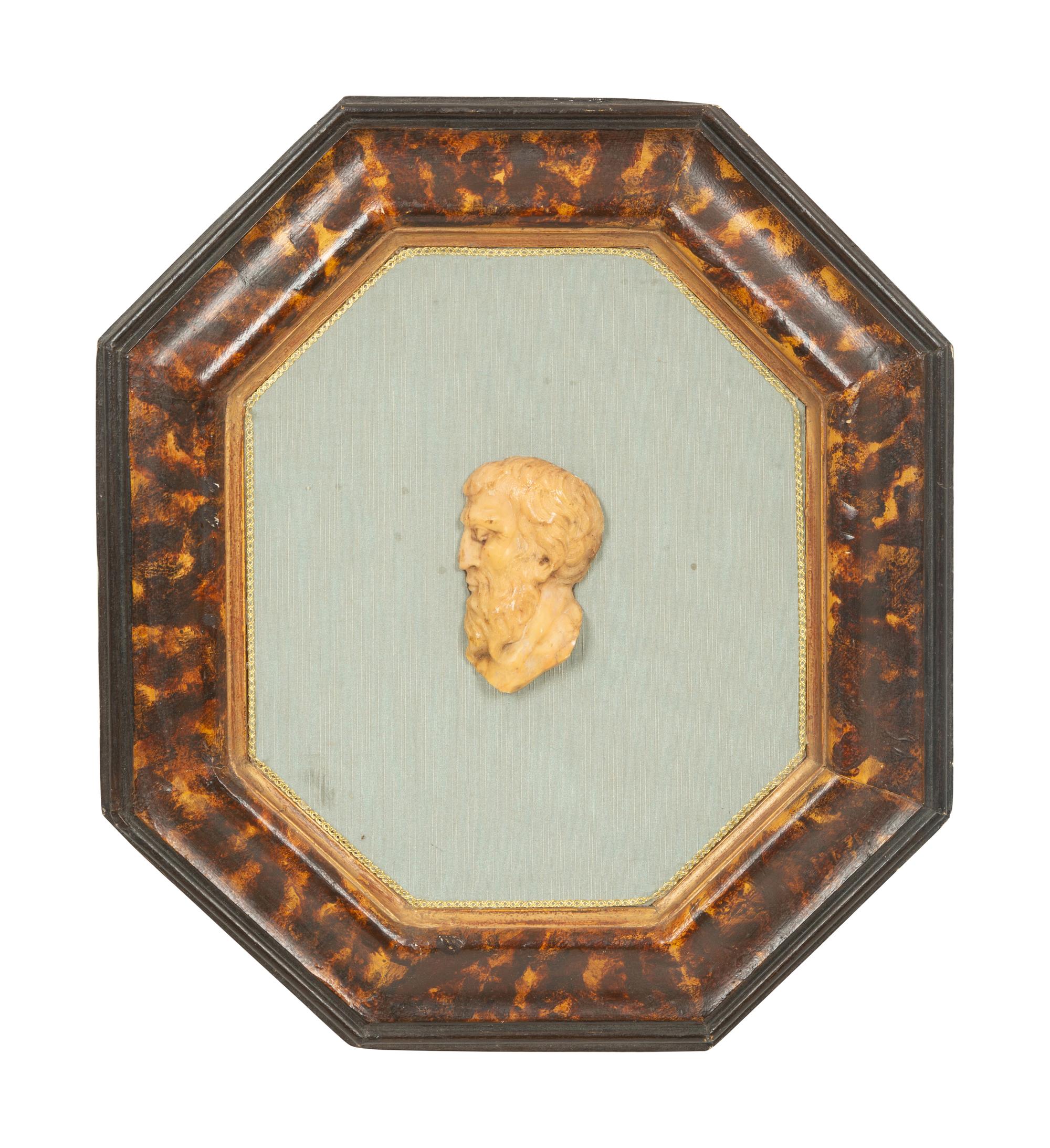 A Pair of Continental Faux Tortoiseshell Painted Framed Composition Plaques of Profile Busts