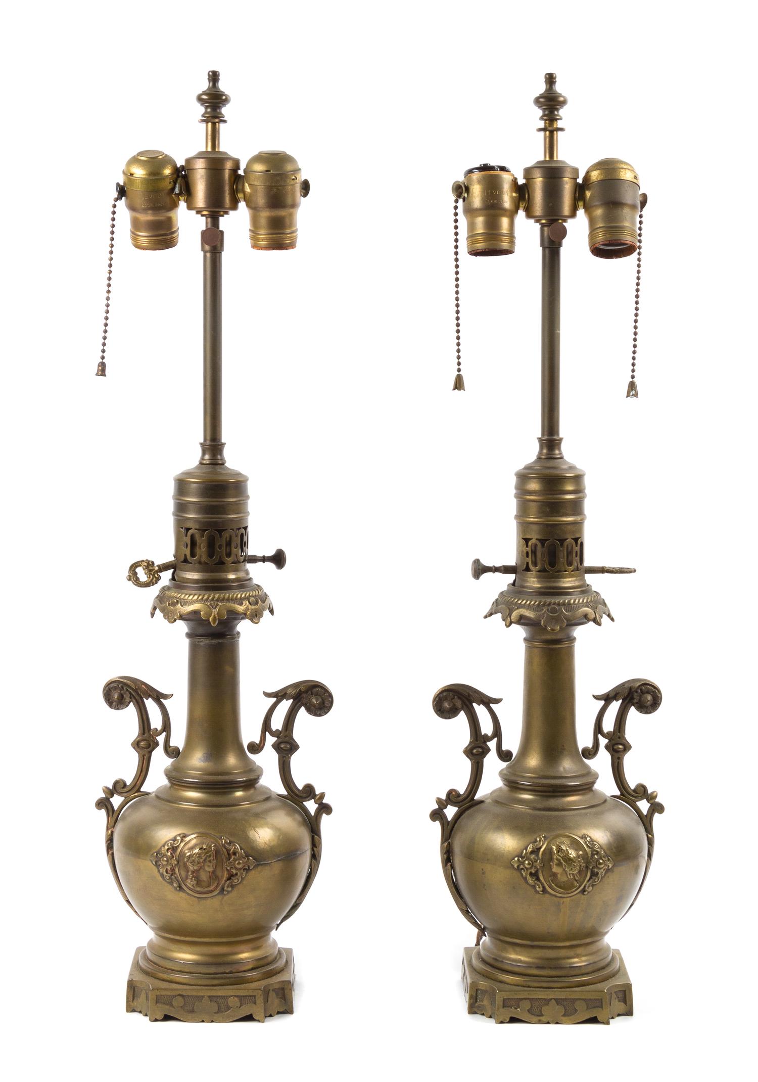 A Pair of Brass Urns Height overall 24 inches.