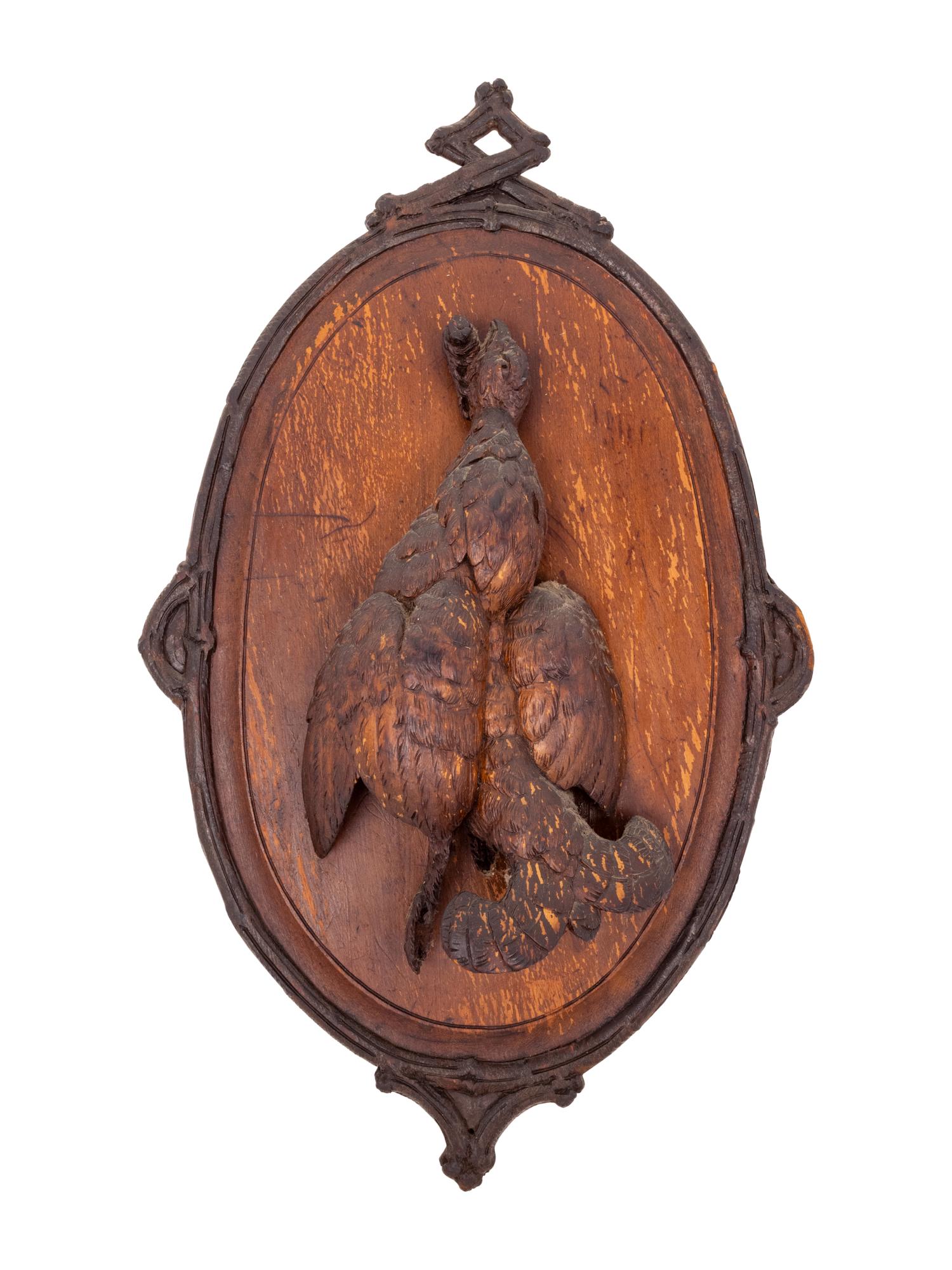 A Black Forest Carved Game Plaque