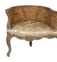 A Louis XV Style Painted Cane Back Tete-a-Tete
