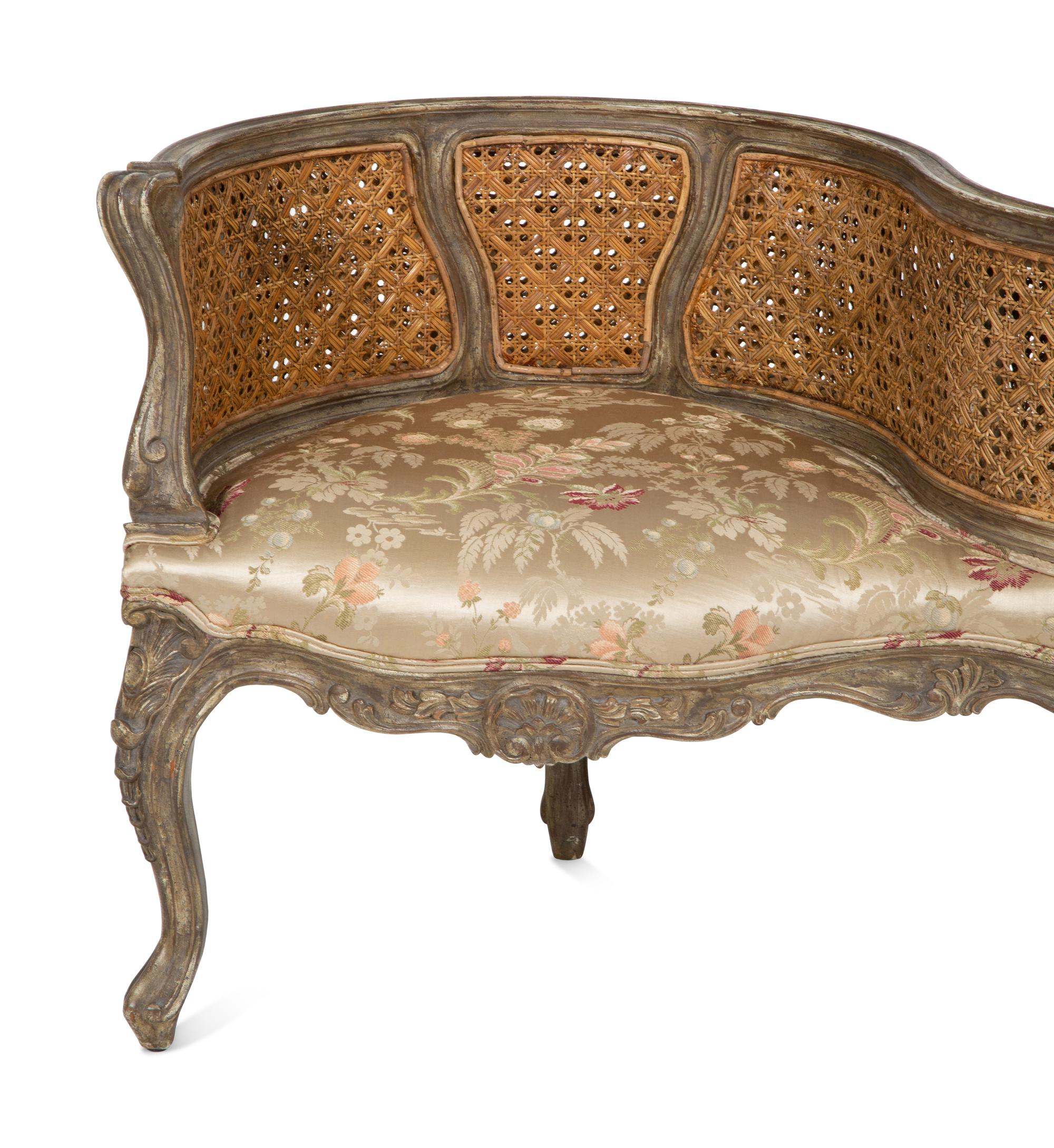 A Louis XV Style Painted Cane Back Tete-a-Tete