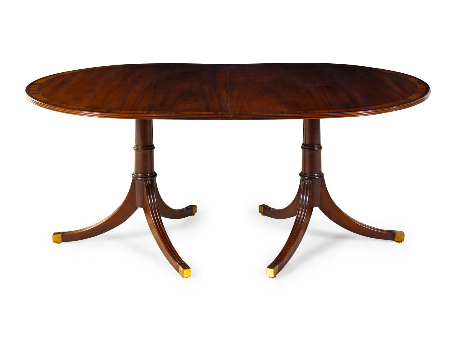 A Regency Style Figured Mahogany Two-Pedestal Dining Table