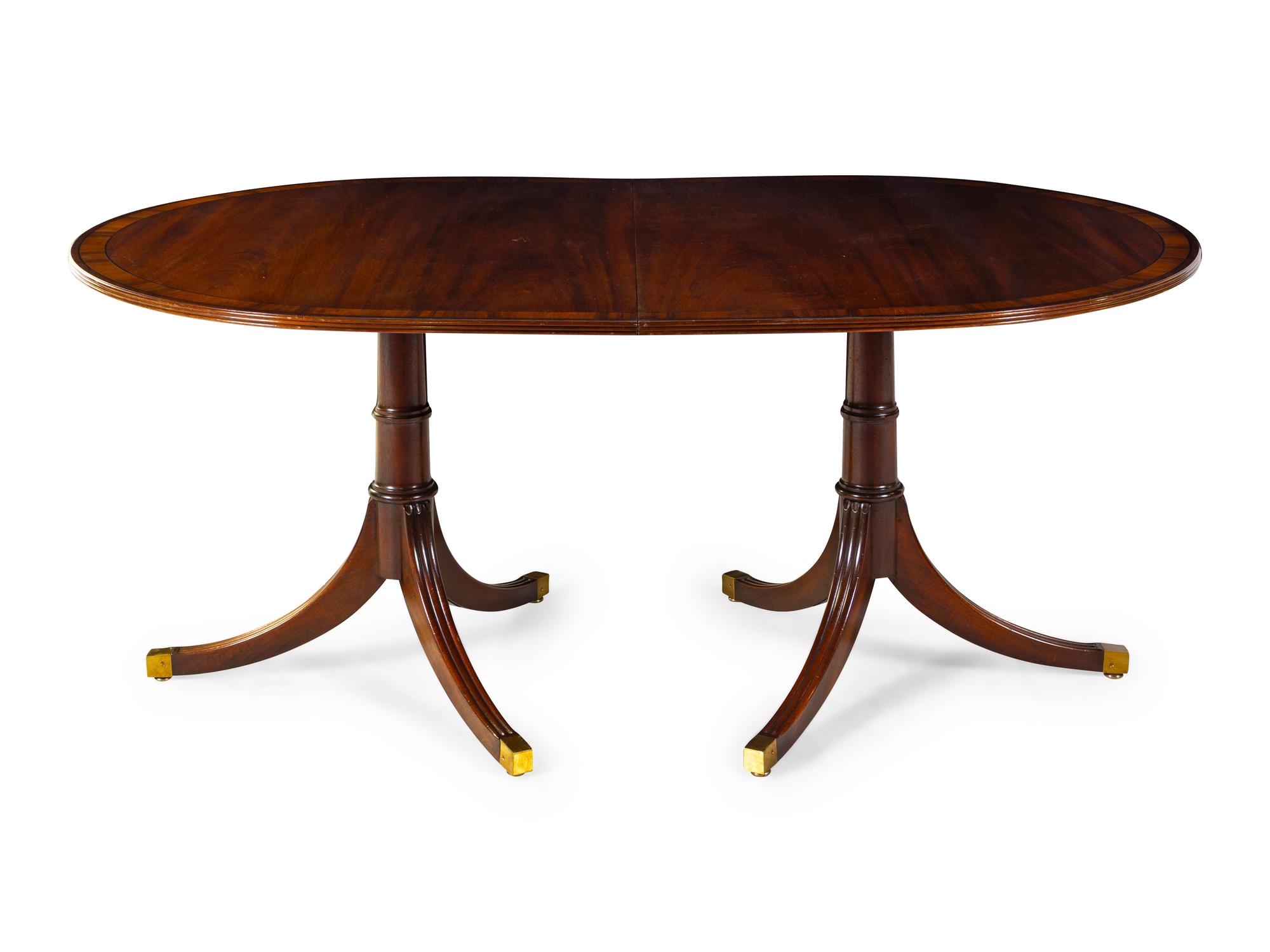 A Regency Style Figured Mahogany Two-Pedestal Dining Table