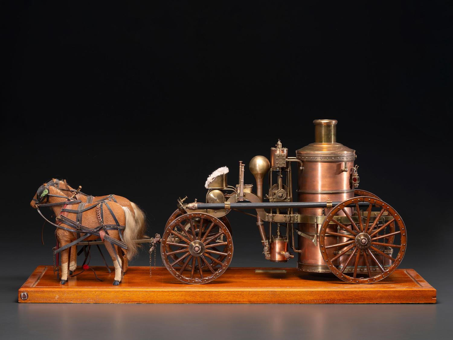 A Copper and Wood Horse-Drawn Steam-Powered Fire Engine Model