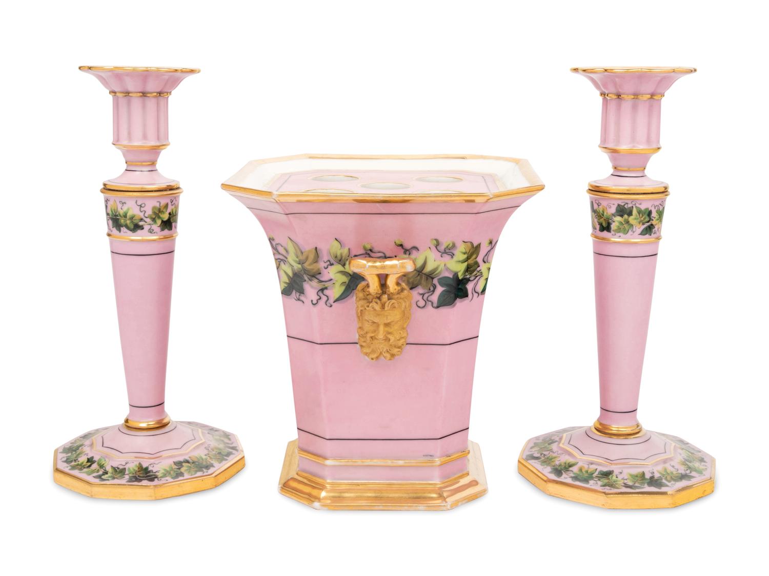 A Pair of Paris Porcelain Pink-Ground Vine-Decorated Candlesticks and a Jardinière