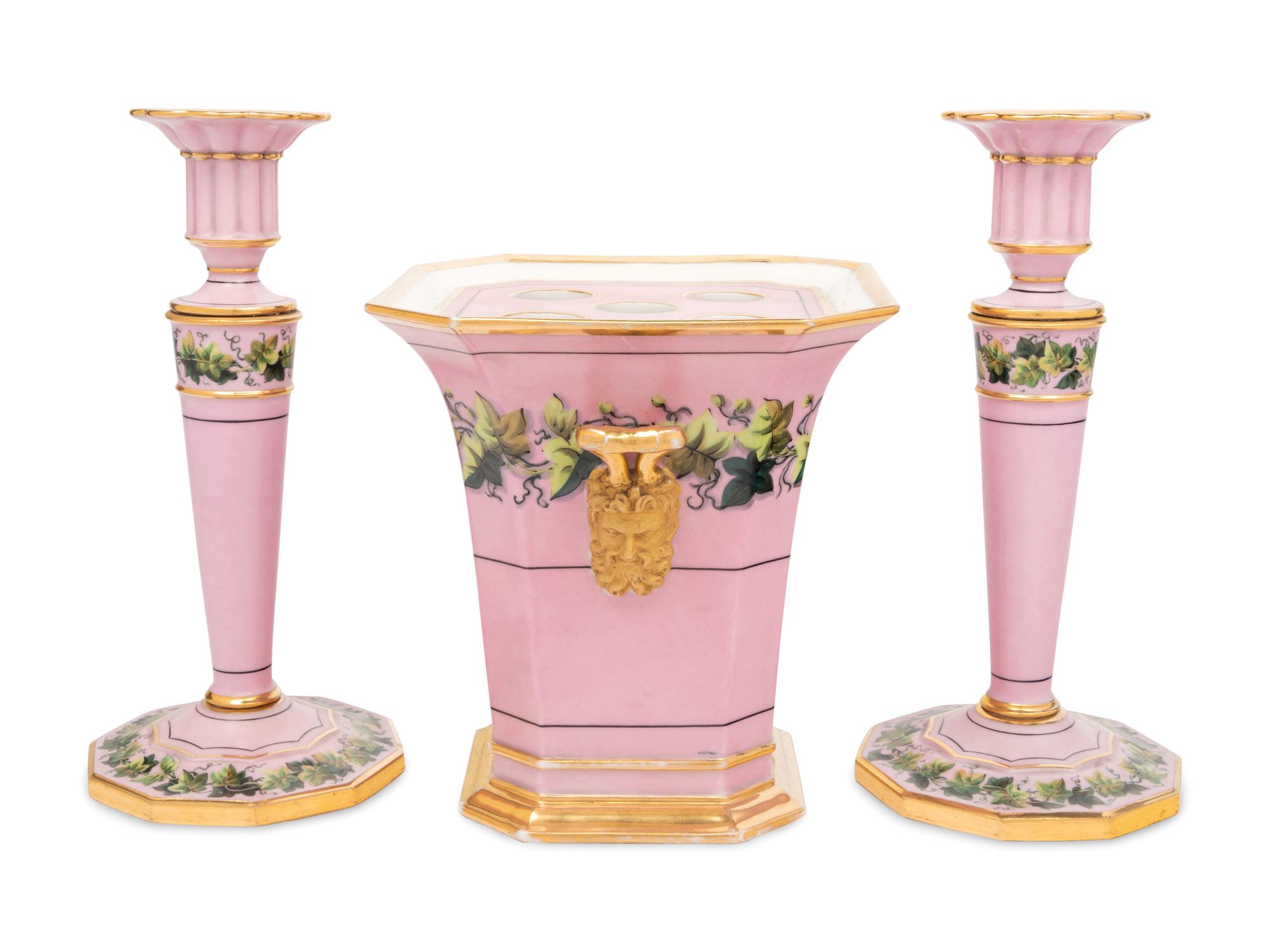 A Pair of Paris Porcelain Pink-Ground Vine-Decorated Candlesticks and a Jardinière