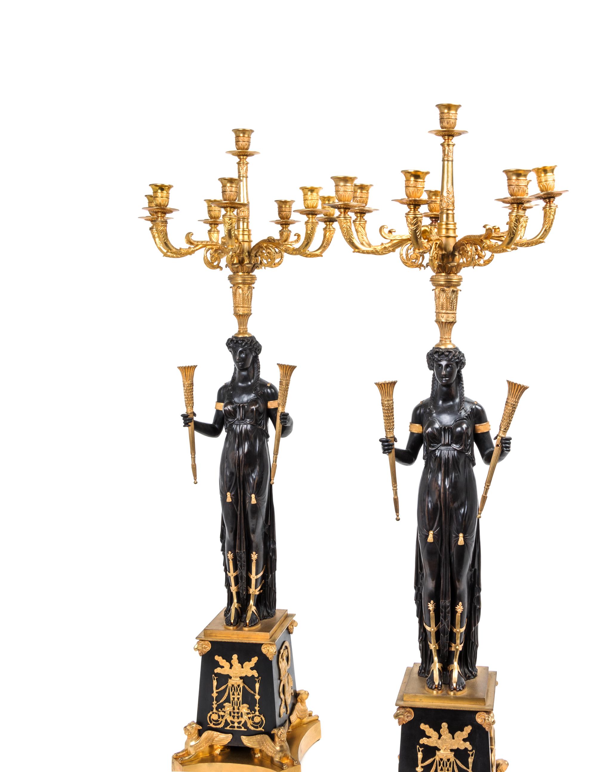 A Pair of Empire Style Gilt and Patinated Bronze Eight-Light Candelabra — MANNER OF PIERRE-PHILIPPE THOMIRE, 19TH CENTURY