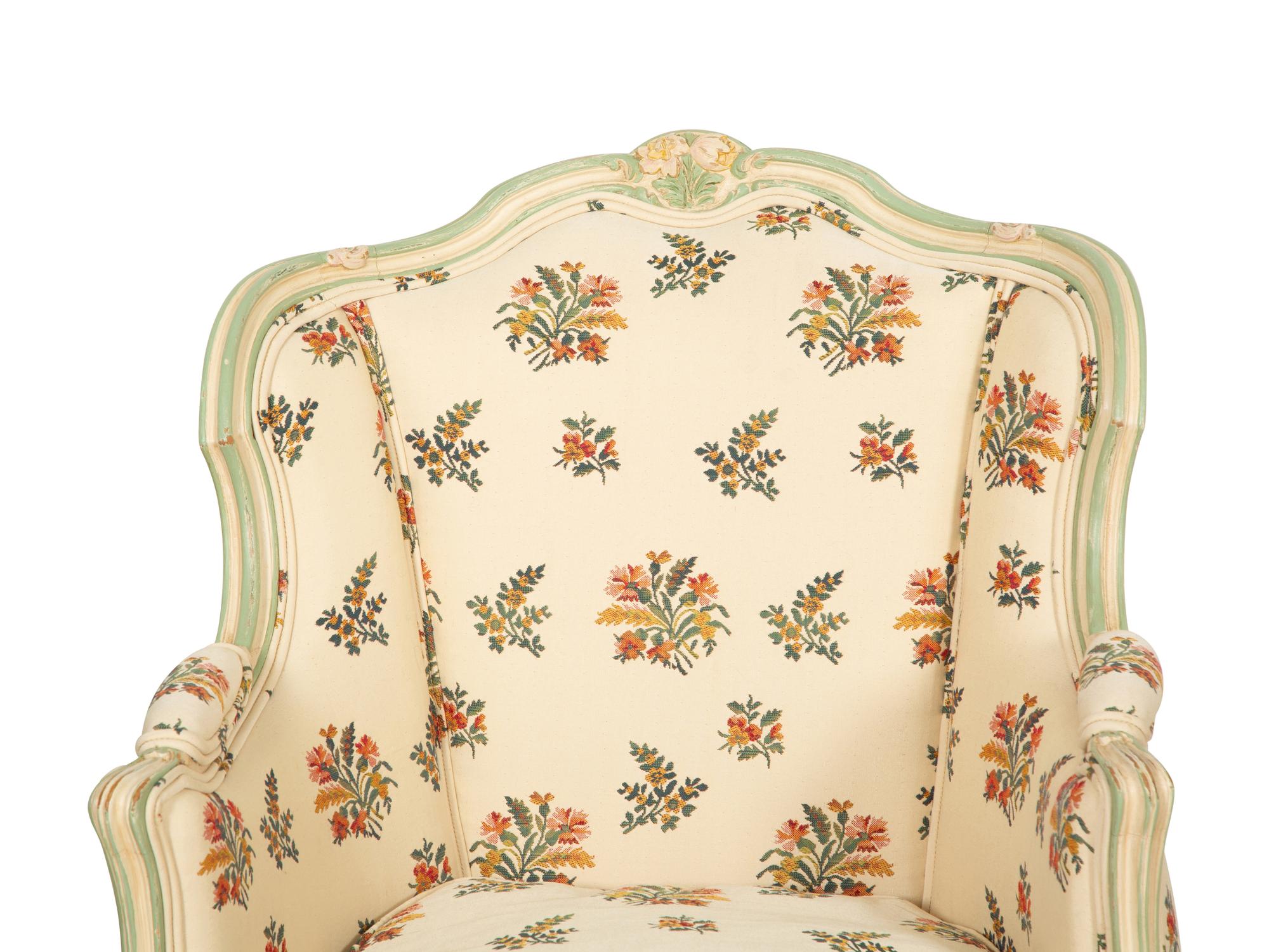 A Pair of Louis XV Style Painted Wingback Bergères and an Associated Stool