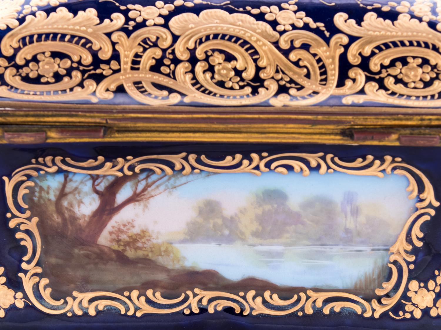 A Sèvres Style Painted and Parcel Gilt Porcelain Table Casket