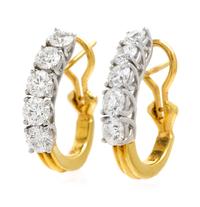 A Pair of Platinum, 18 Karat Yellow Gold and Diamond Earclips, 5.90 dwts.