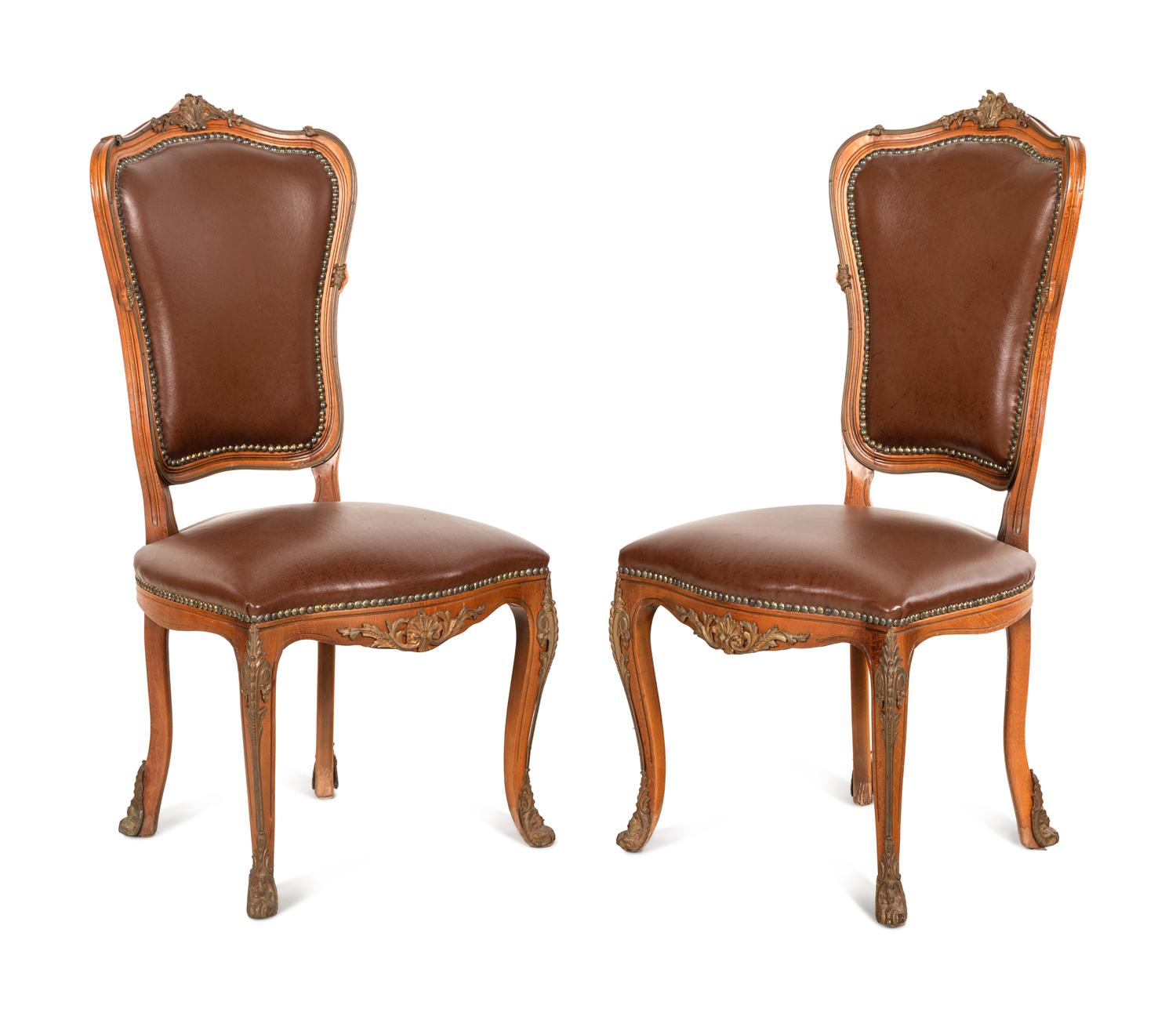 A Set of Four Louis XV Style Gilt Bronze Mounted Dining Chairs