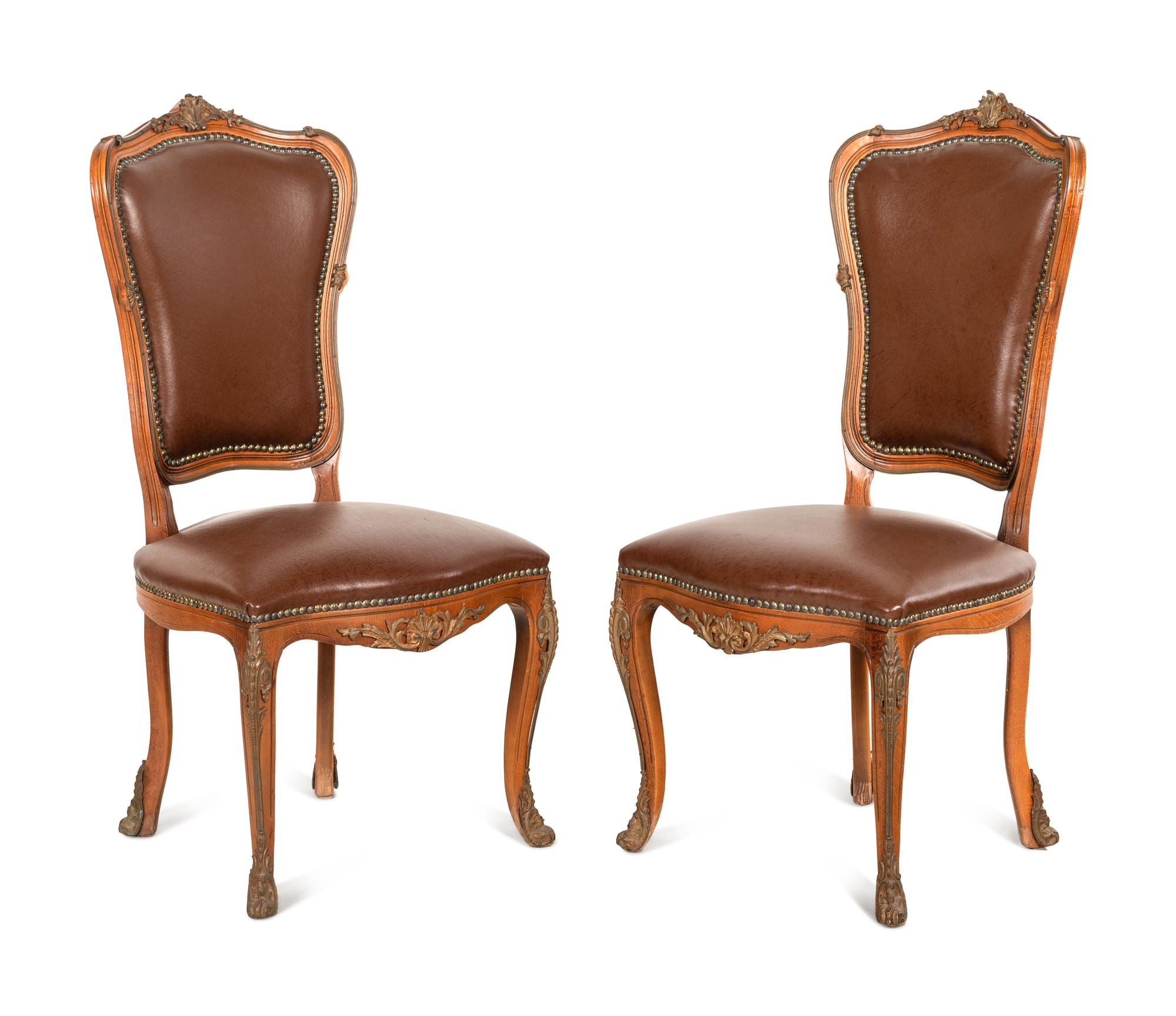 A Set of Four Louis XV Style Gilt Bronze Mounted Dining Chairs