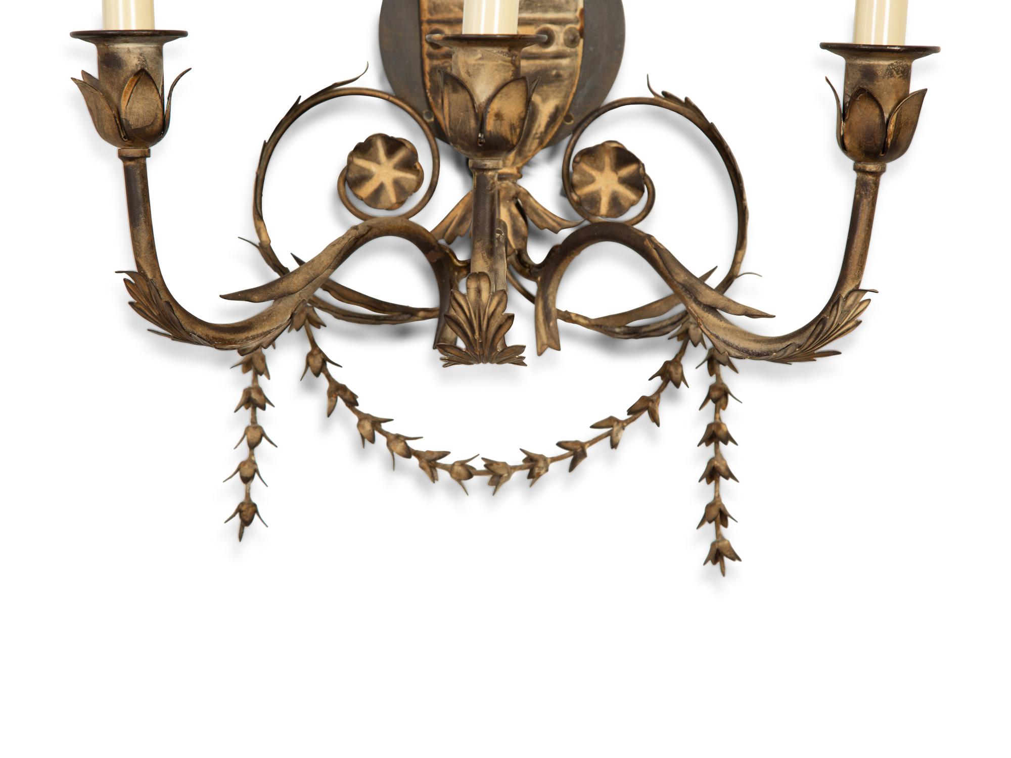 A Set of Four Neoclassical Style Pressed Metal Two-Light Sconces