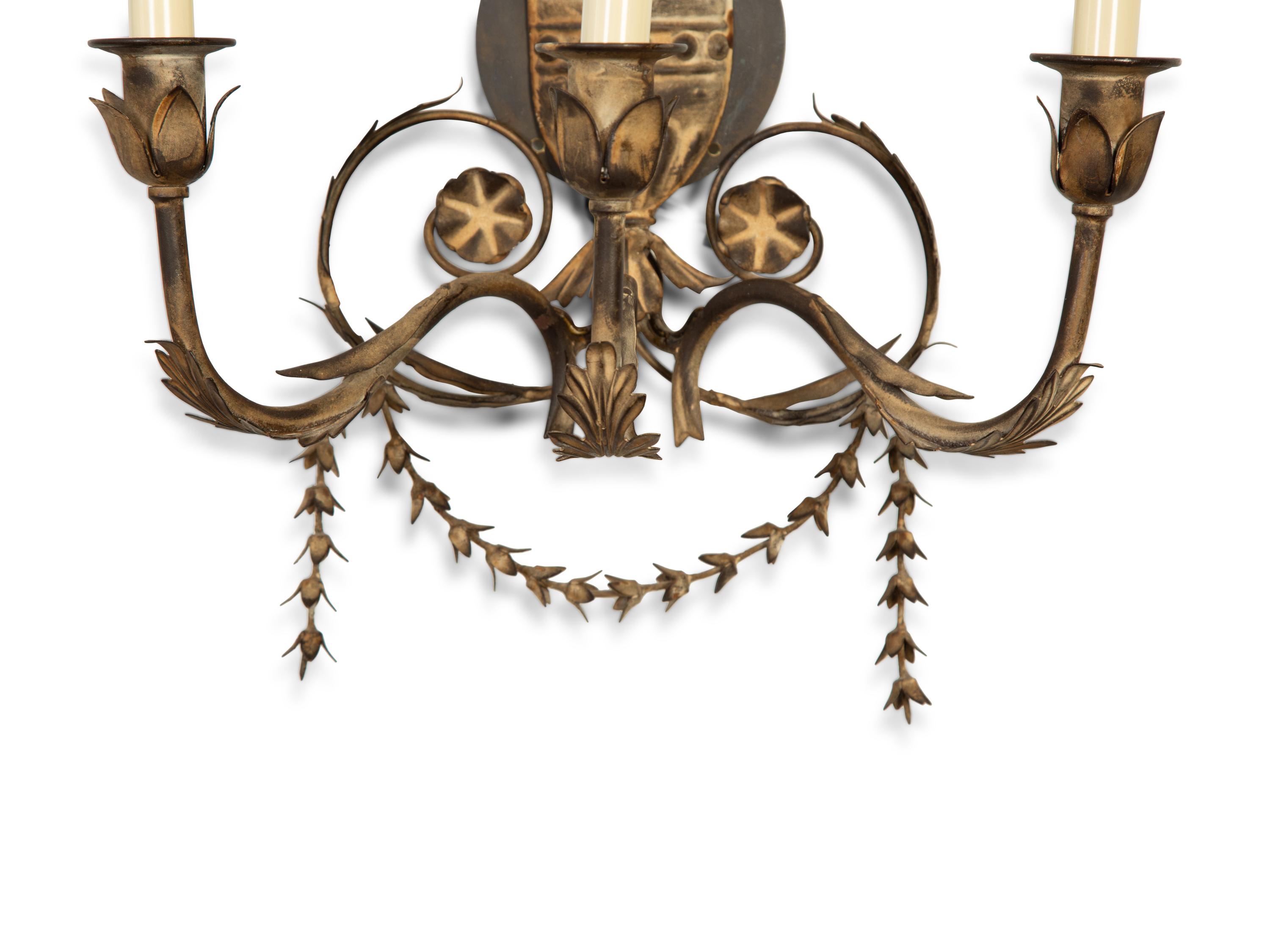 A Set of Four Neoclassical Style Pressed Metal Two-Light Sconces