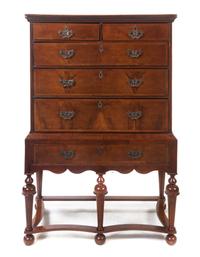 A William & Mary Style Walnut Chest on Stand, Height 58 x width 38 1/4 x depth 20 1/2 inches.