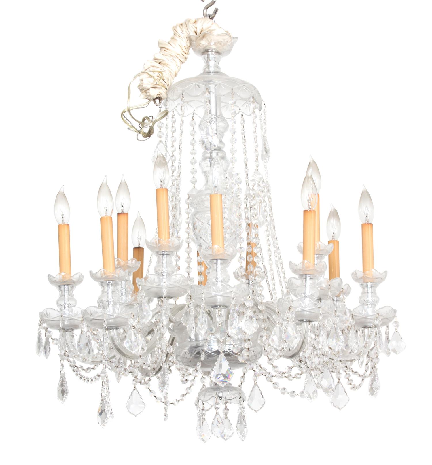 A Cut Glass Twelve Light Chandelier Height 35 to top of first hanger x diameter 27 inches. — 20TH CENTURY
