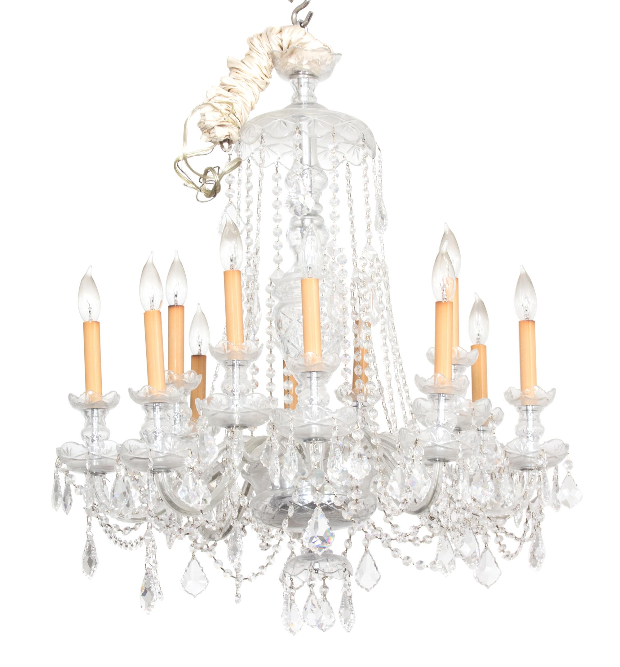 A Cut Glass Twelve Light Chandelier Height 35 to top of first hanger x diameter 27 inches. — 20TH CENTURY