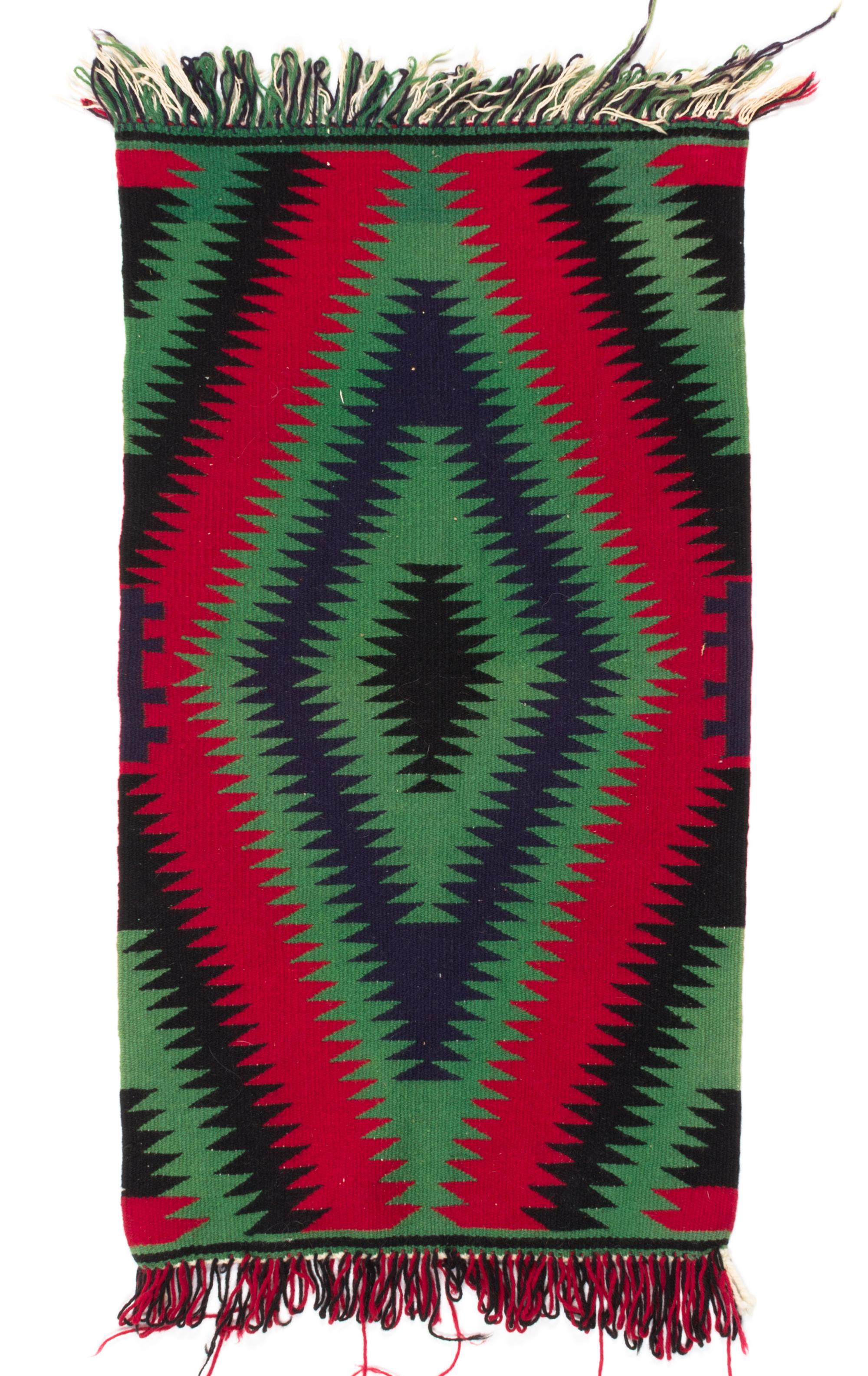 A Navajo Germantown 36 x 19 1/4 inches.