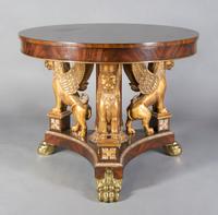 An Empire Style Mahogany Center Table, Height 32 1/2 x diameter 40 inches.