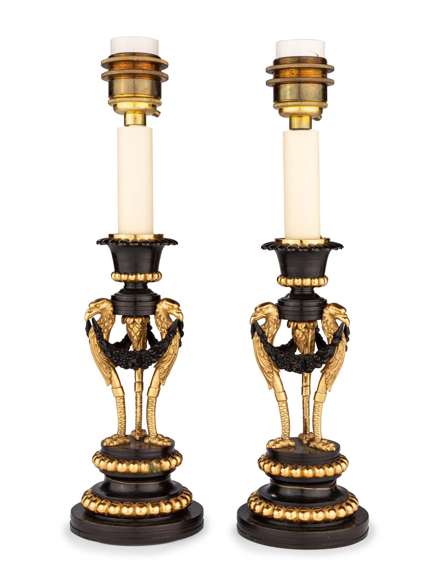 A Pair of Directoire Parcel-Gilt Bronze Candlesticks