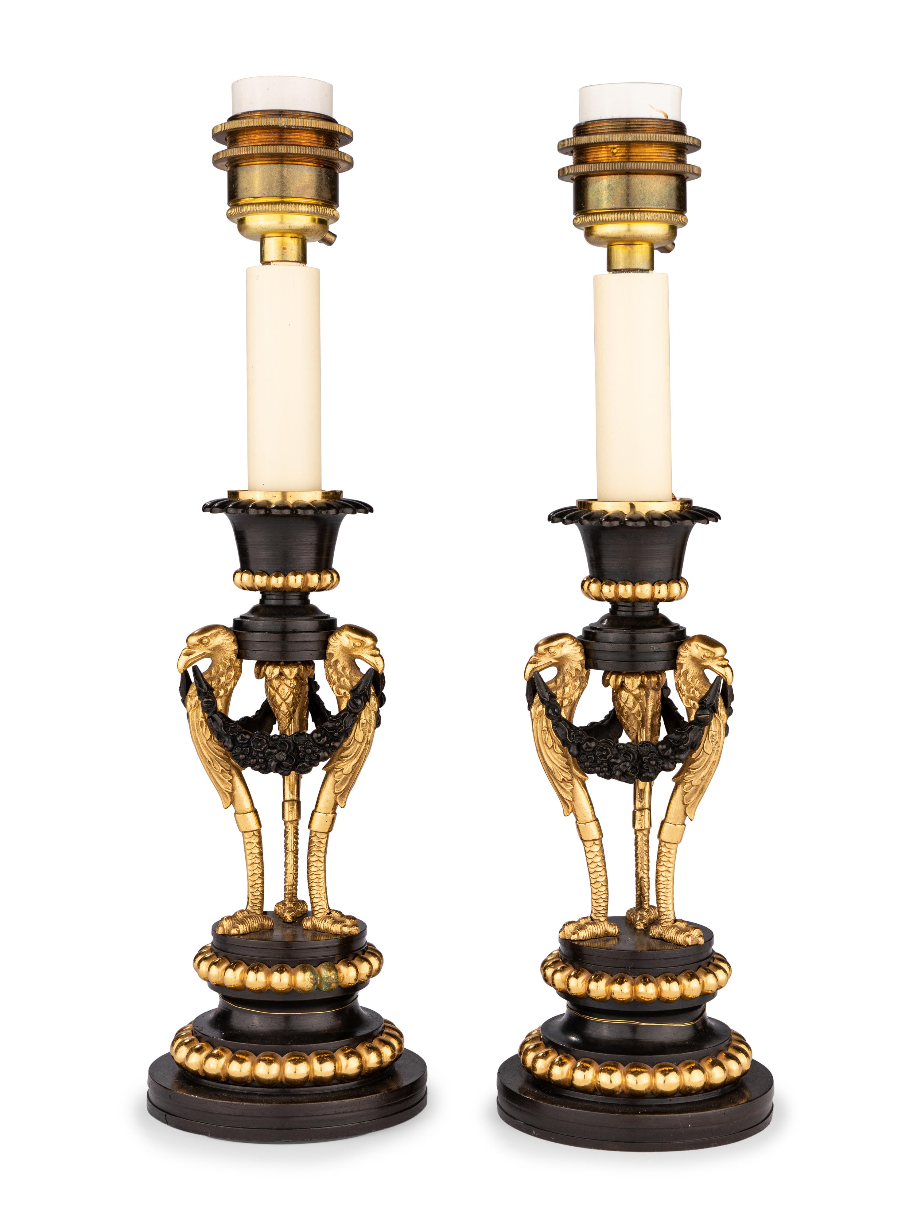 A Pair of Directoire Parcel-Gilt Bronze Candlesticks