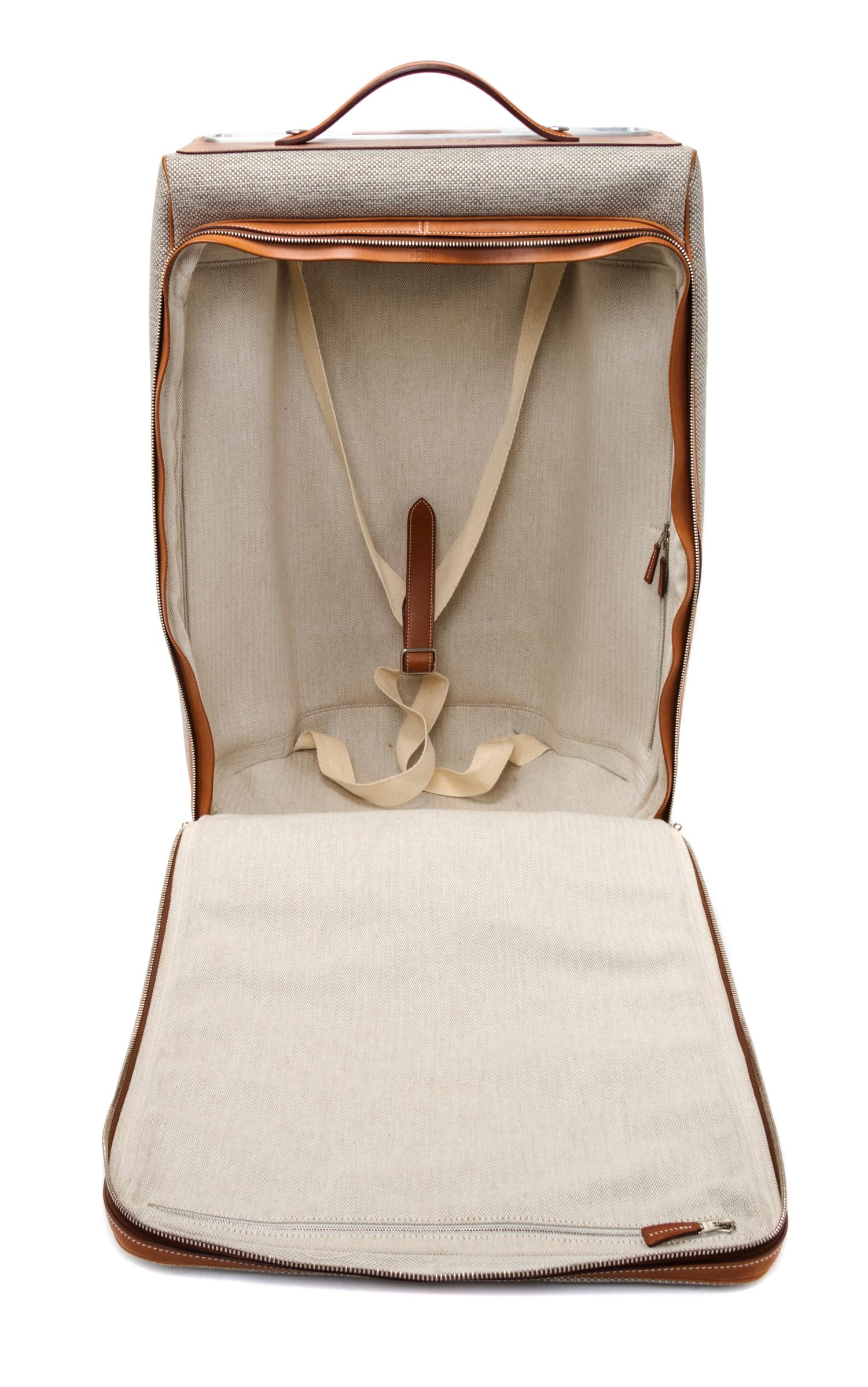 An Hermes Ecru Canvas and Fawn Barenia Calfskin Caleche-Express Suitcase, 14" x 21.5" x 10".