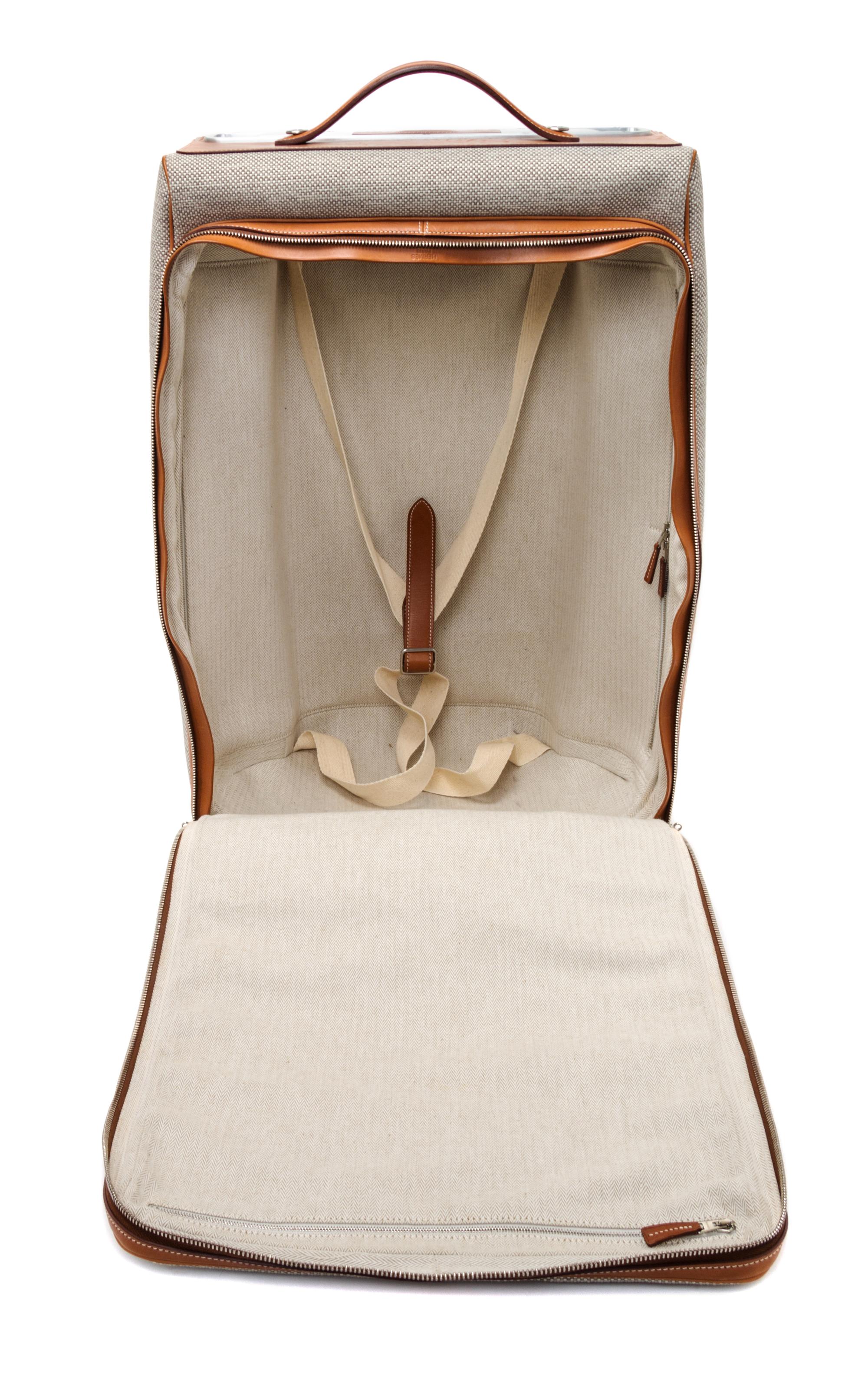 An Hermes Ecru Canvas and Fawn Barenia Calfskin Caleche-Express Suitcase, 14" x 21.5" x 10".