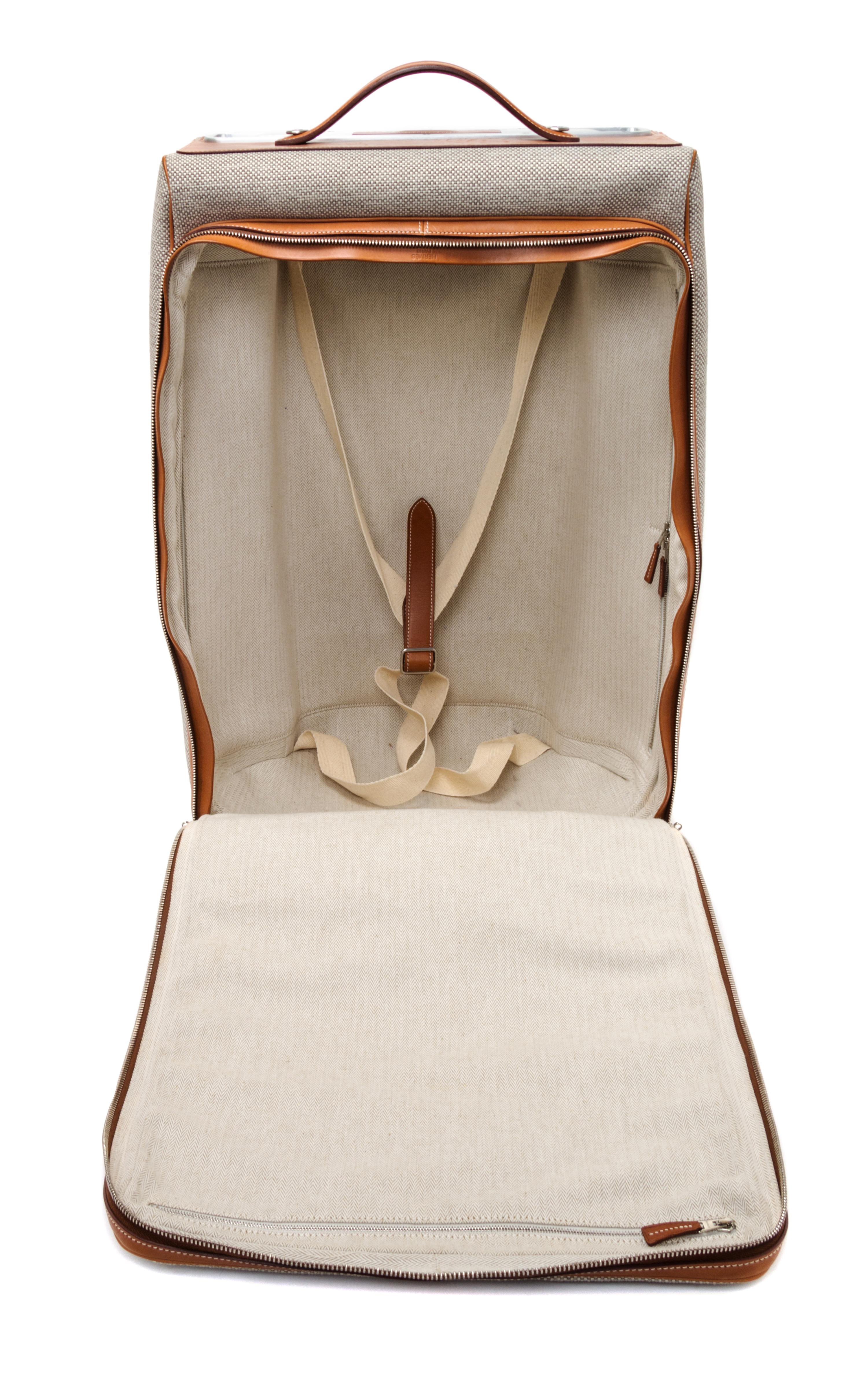 An Hermes Ecru Canvas and Fawn Barenia Calfskin Caleche-Express Suitcase, 14" x 21.5" x 10".