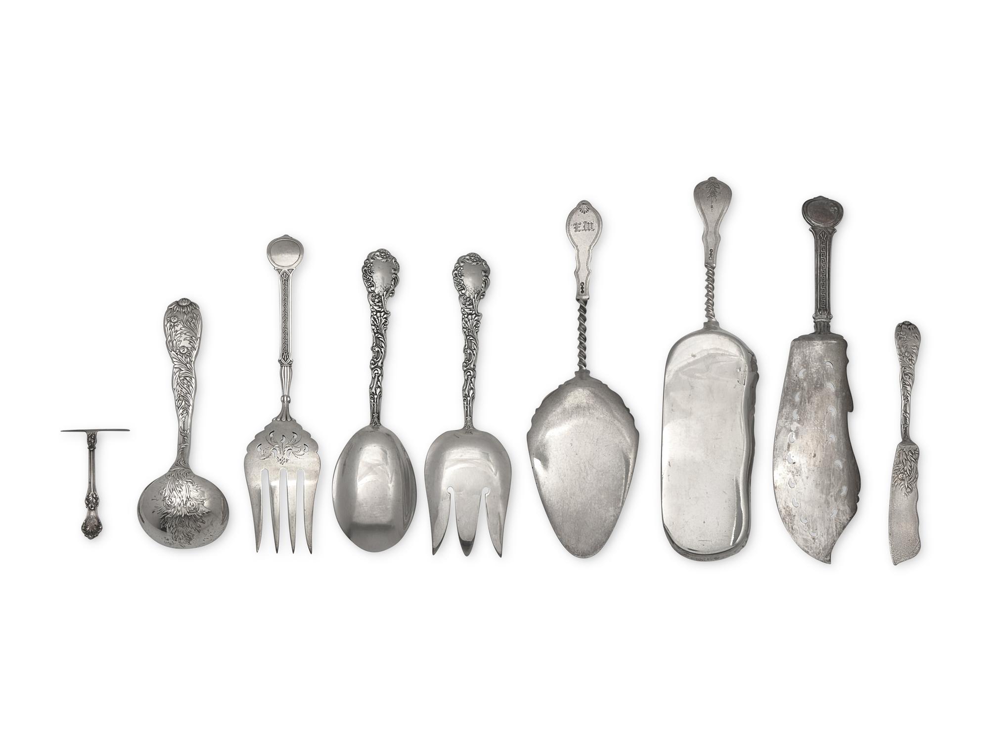 An Assembled Group of Eighteen Sterling Silver and Silver Serving Pieces, Various Makers, Late 19th / Early 20th Century