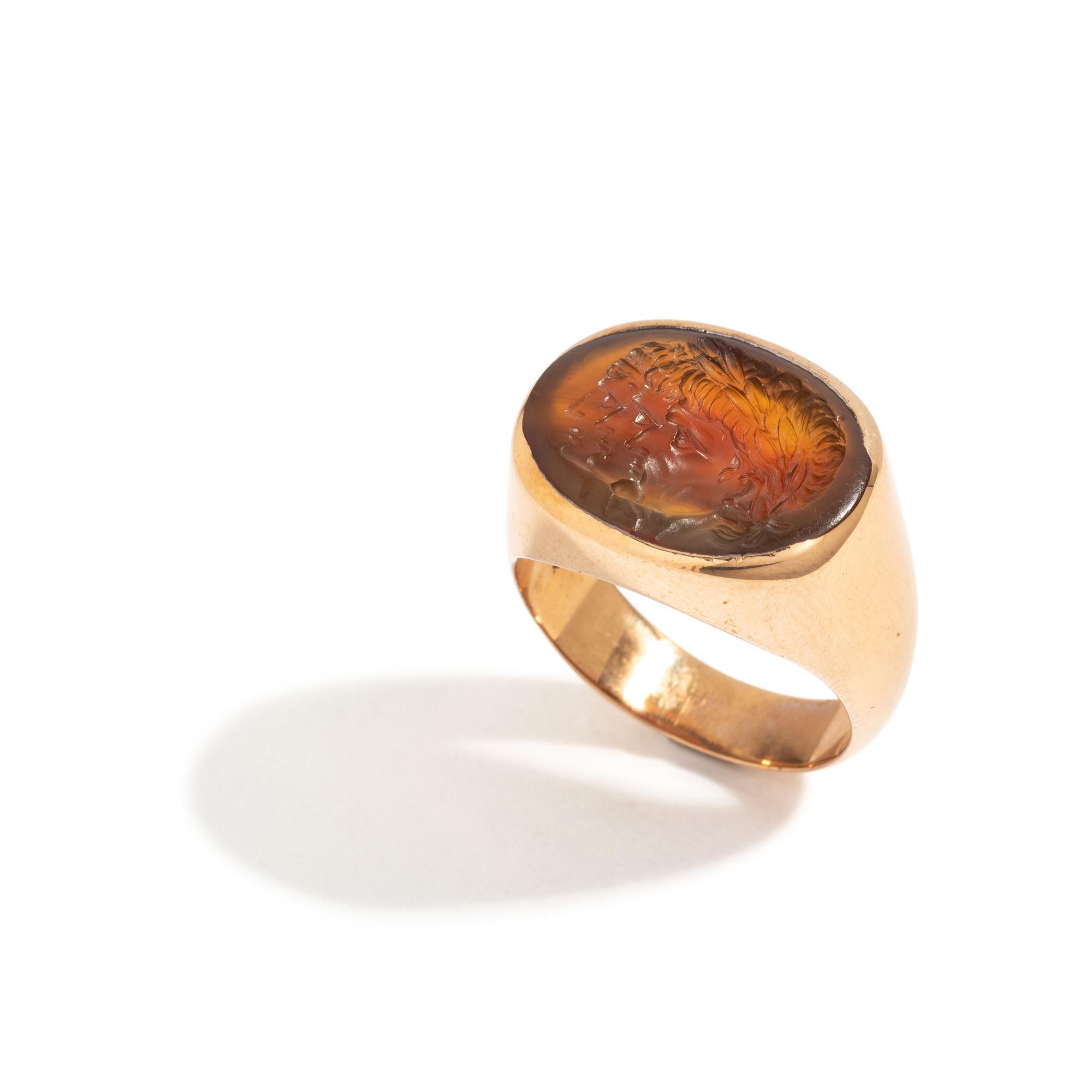 A Neoclassical Carnelian and Gold Finger Ring with a Roman Triumvir