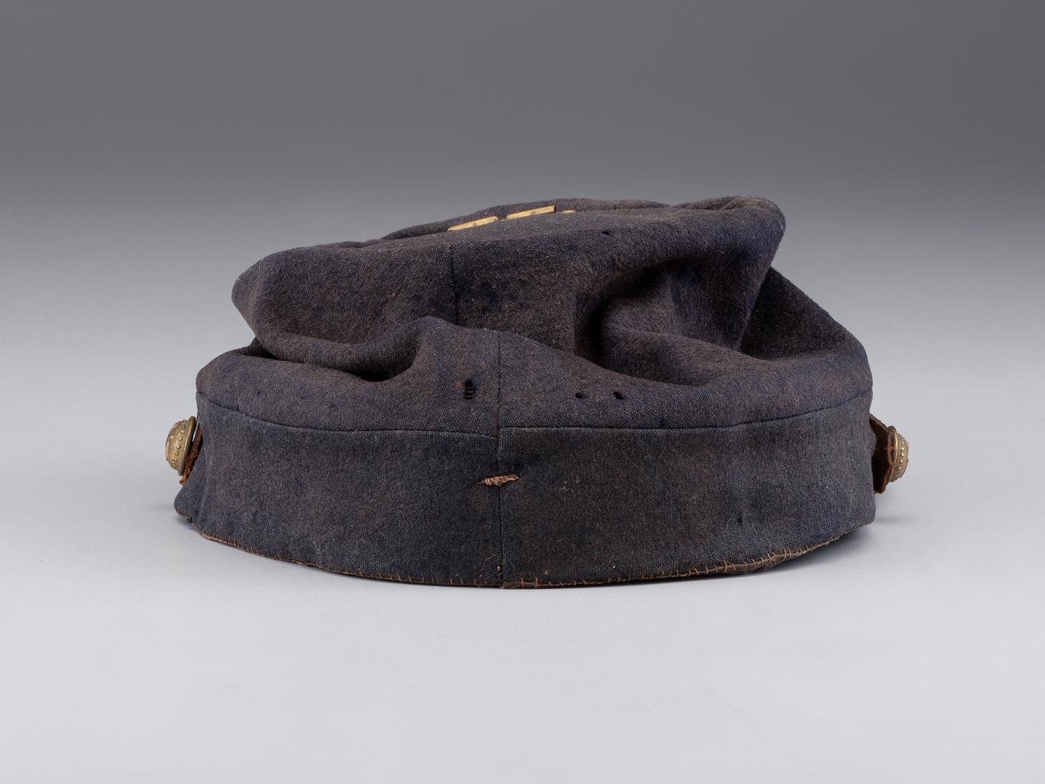 [CIVIL WAR]. A collection of items identified to brothers Robert and Samuel Burnside, Company H, 110th New York Infantry, comprised of a kepi and war-date photographs.