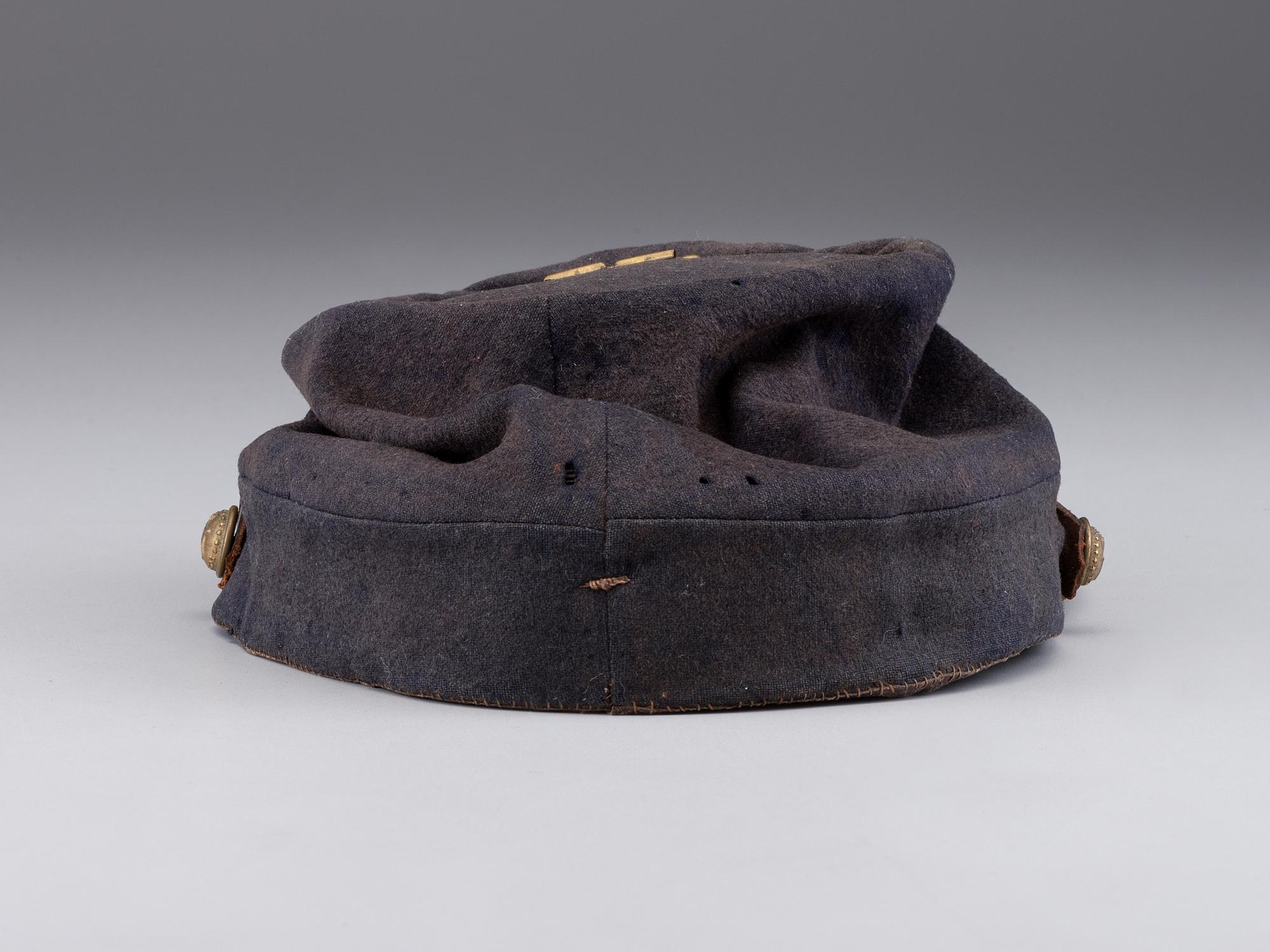 [CIVIL WAR]. A collection of items identified to brothers Robert and Samuel Burnside, Company H, 110th New York Infantry, comprised of a kepi and war-date photographs.
