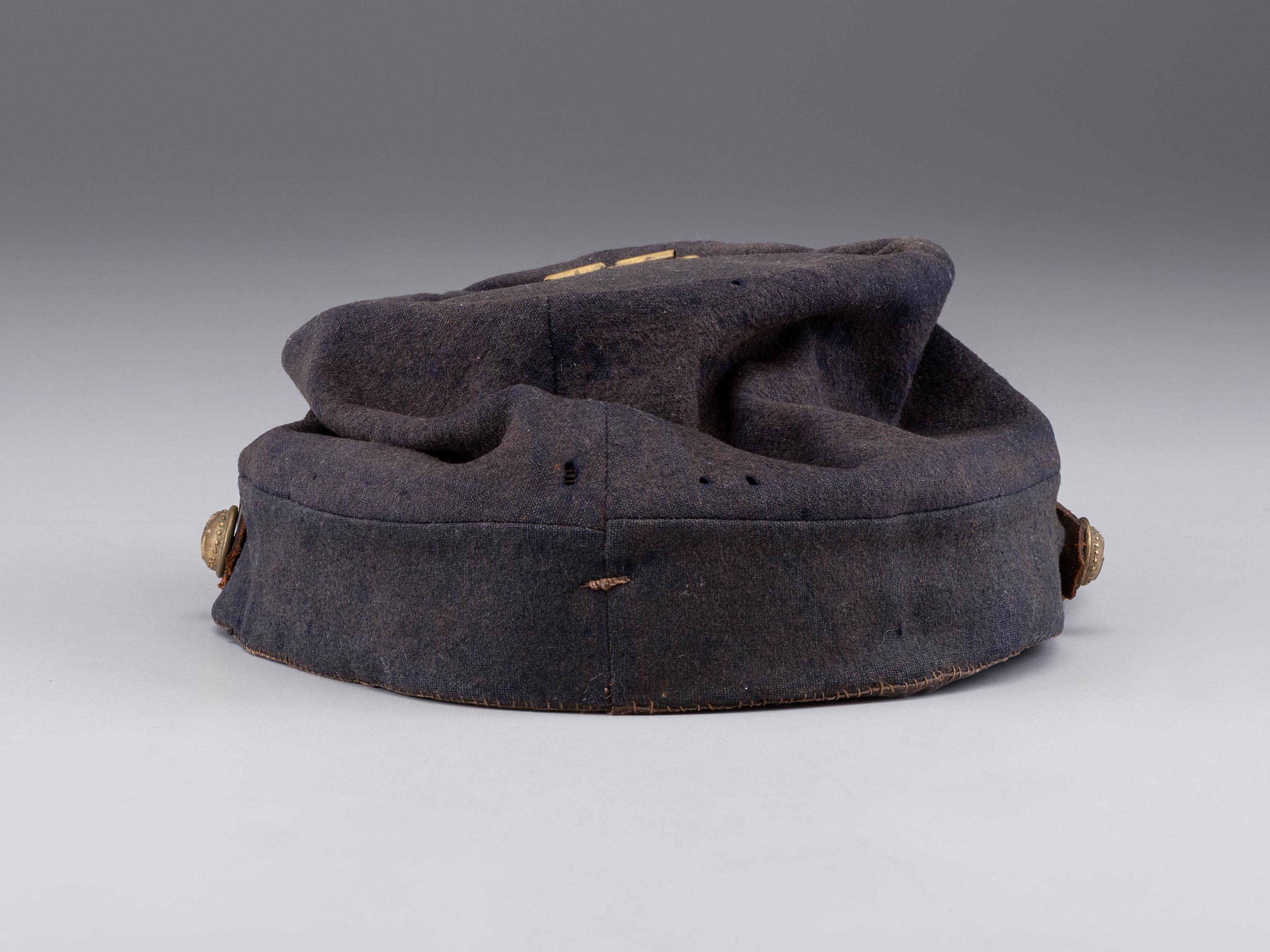 [CIVIL WAR]. A collection of items identified to brothers Robert and Samuel Burnside, Company H, 110th New York Infantry, comprised of a kepi and war-date photographs.