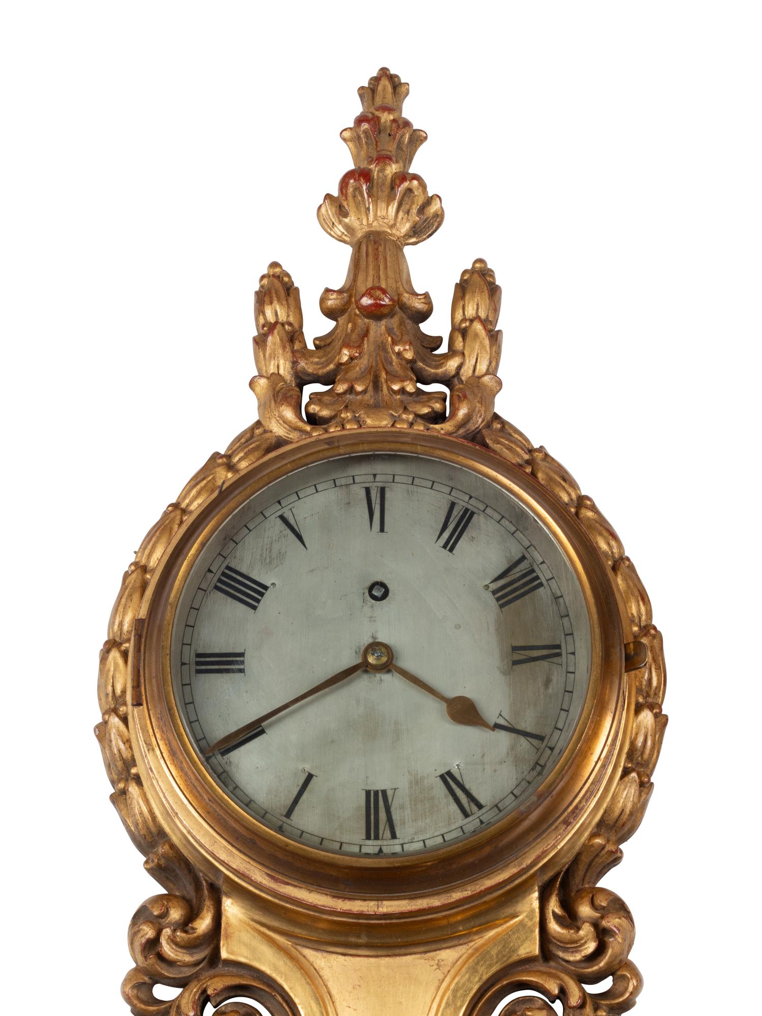A French Carved Giltwood Clock and Barometer
