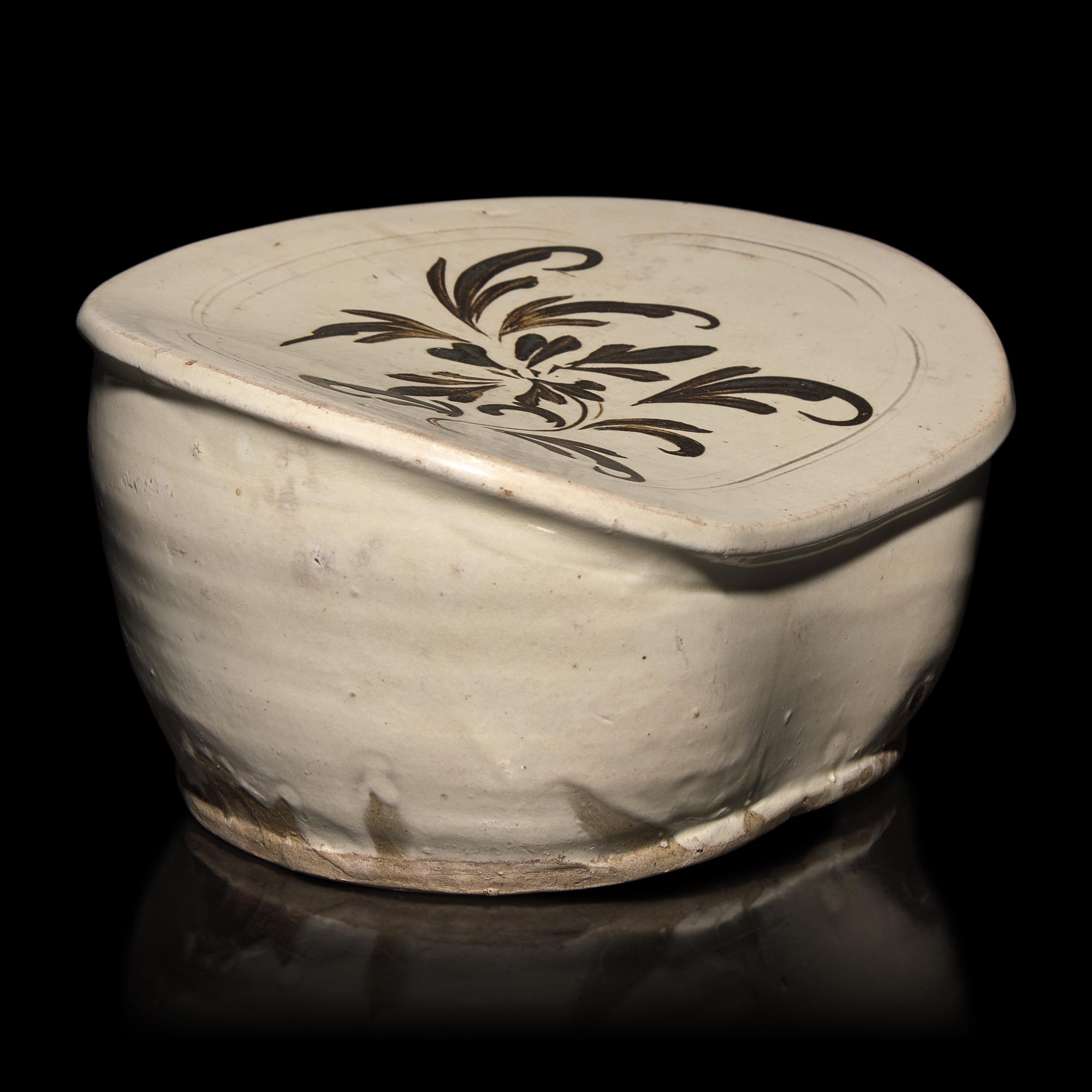 A Chinese Cizhou Slip-Decorated Pillow, Song Dynasty — 宋 磁州窯萱草紋枕