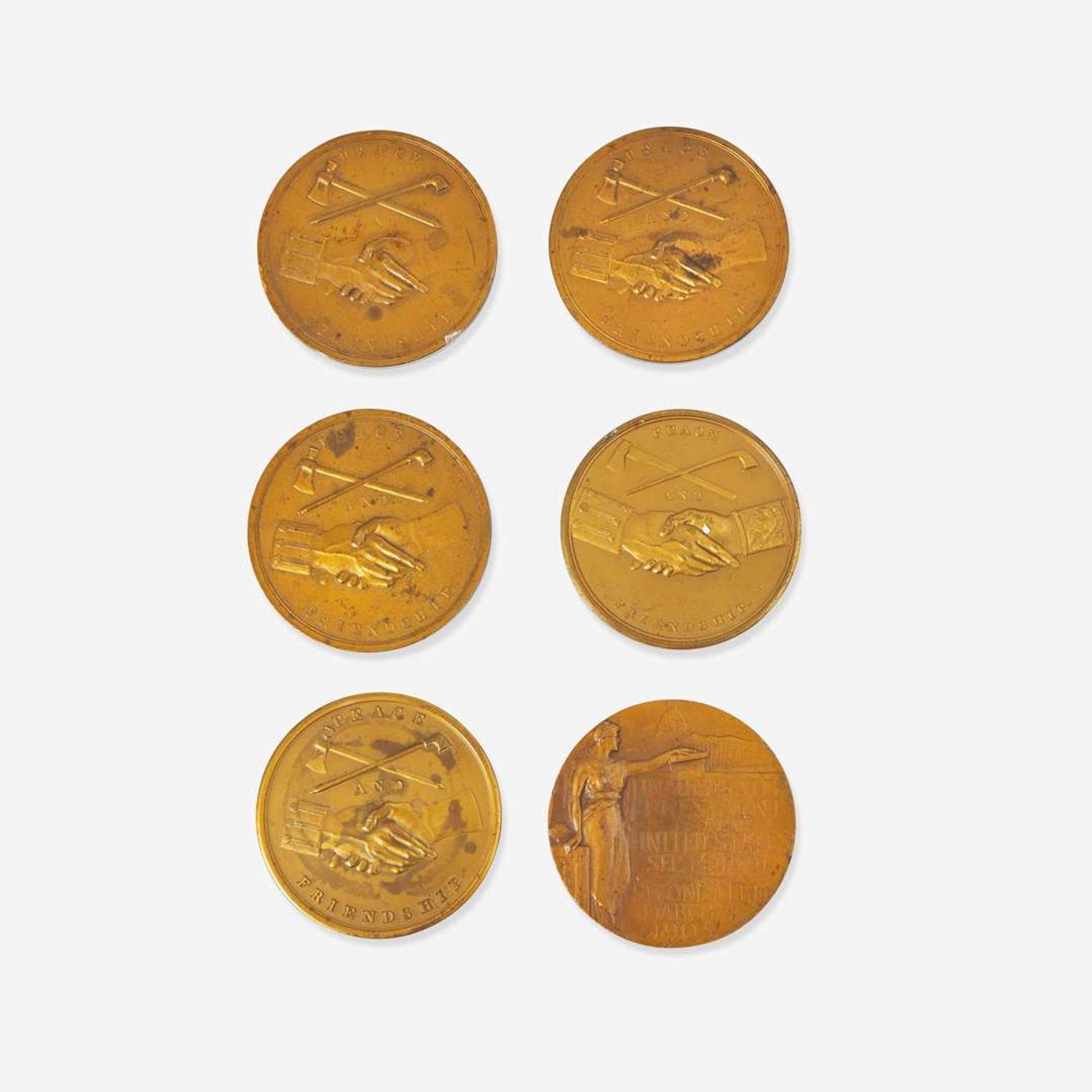 A group of six bronze medallions depicting American presidents, early 20th century