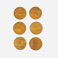 A group of six bronze medallions depicting American presidents, early 20th century