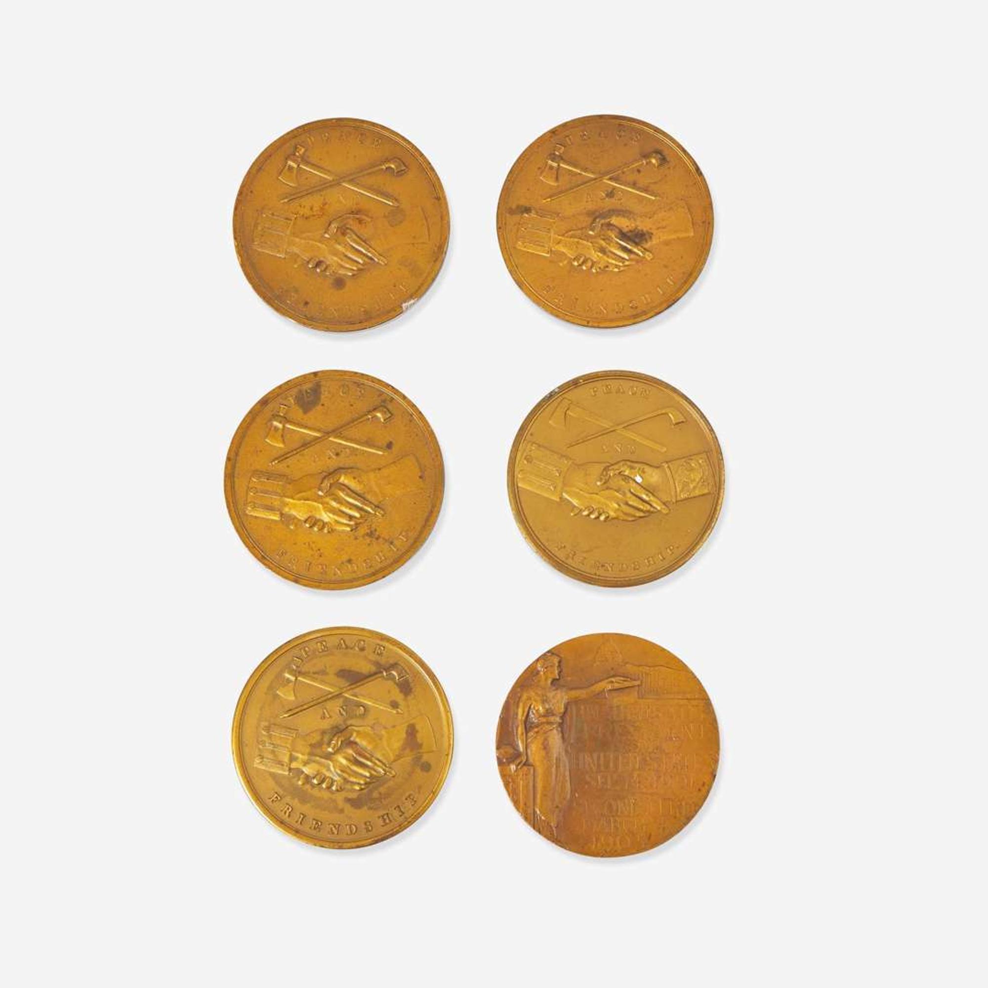 A group of six bronze medallions depicting American presidents, early 20th century