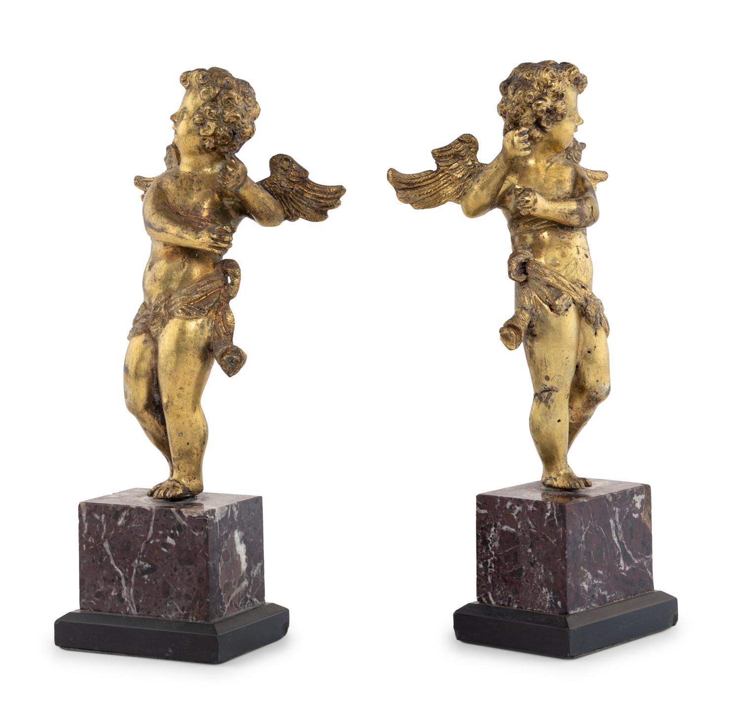 A Pair of Continental Gilt Bronze Figures of Putti