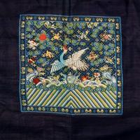 A Chinese Navy Blue Ground Official's Surcoat, Bufu, and A Velvet-Brimmed Winter Hat, Jiguan, 19th Century 清中晚期 藍地一品文官補服及冬吉冠一頂