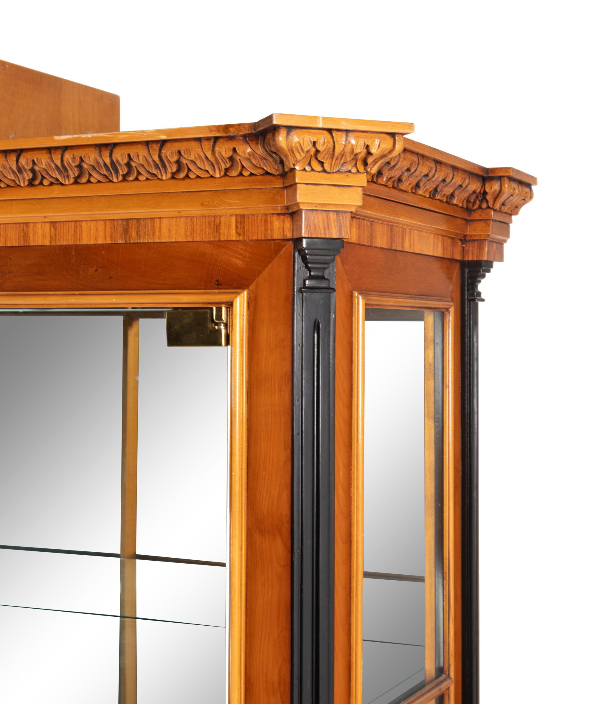 A Biedermeier Style Part-Ebonized Walnut Vitrine Cabinet