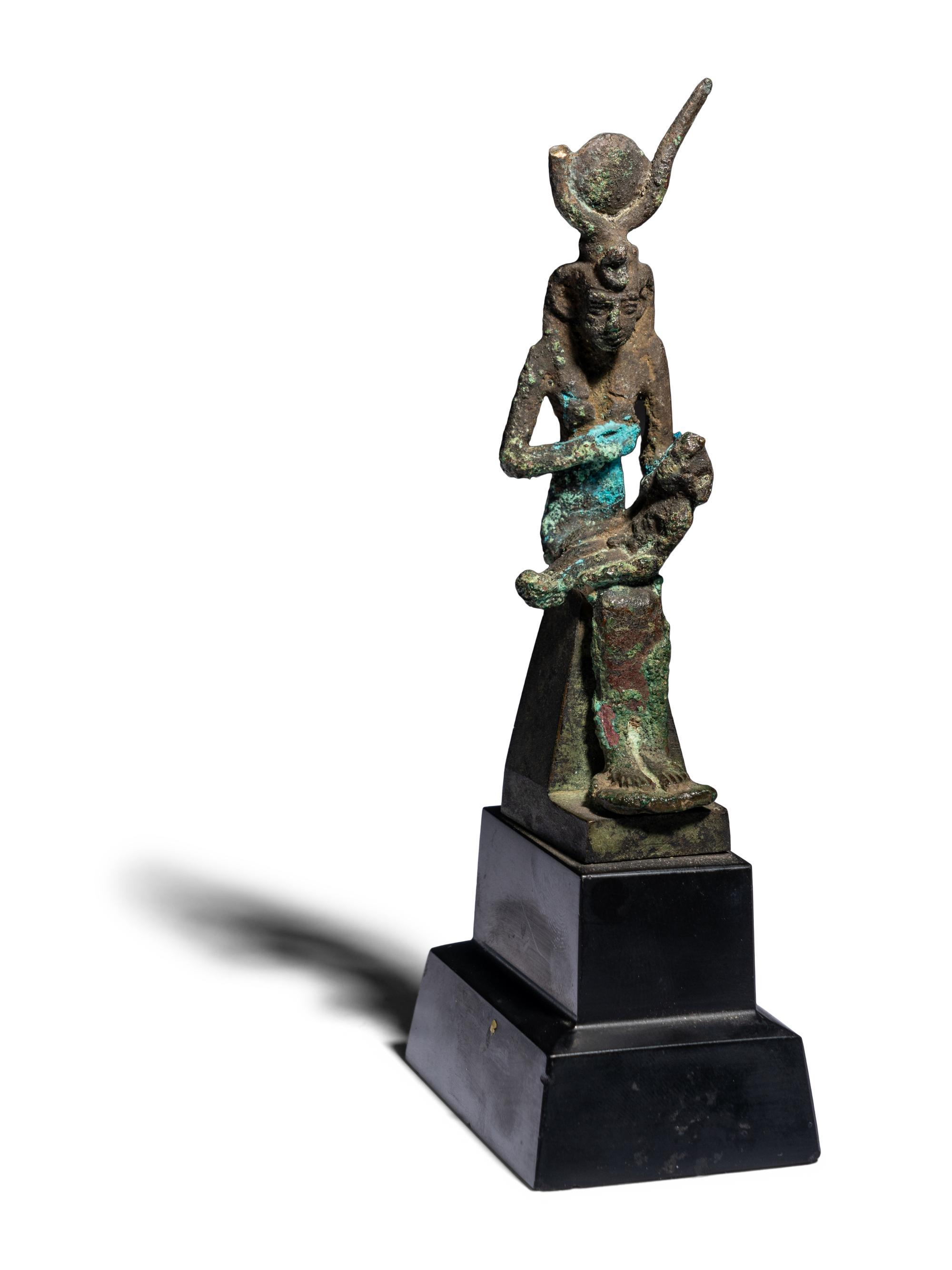 An Egyptian Bronze Isis Nursing Harpocrates