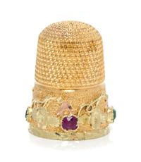 An American Gold and Gemstone Thimble, , the knurled top and body above a floral and foliate band inset with two rubies and two green b