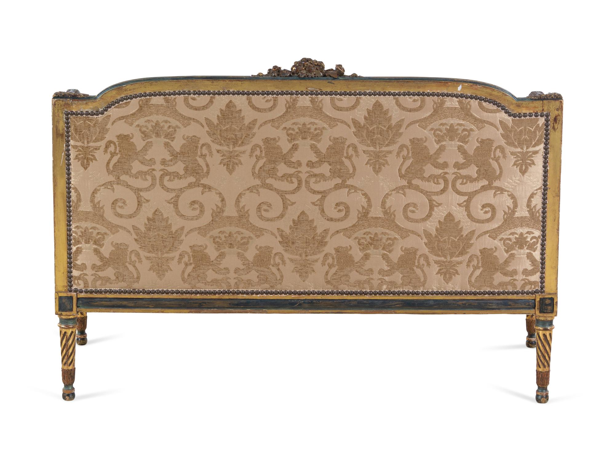 A Louis XV/XVI Transitional Style Painted and Parcel Gilt Settee