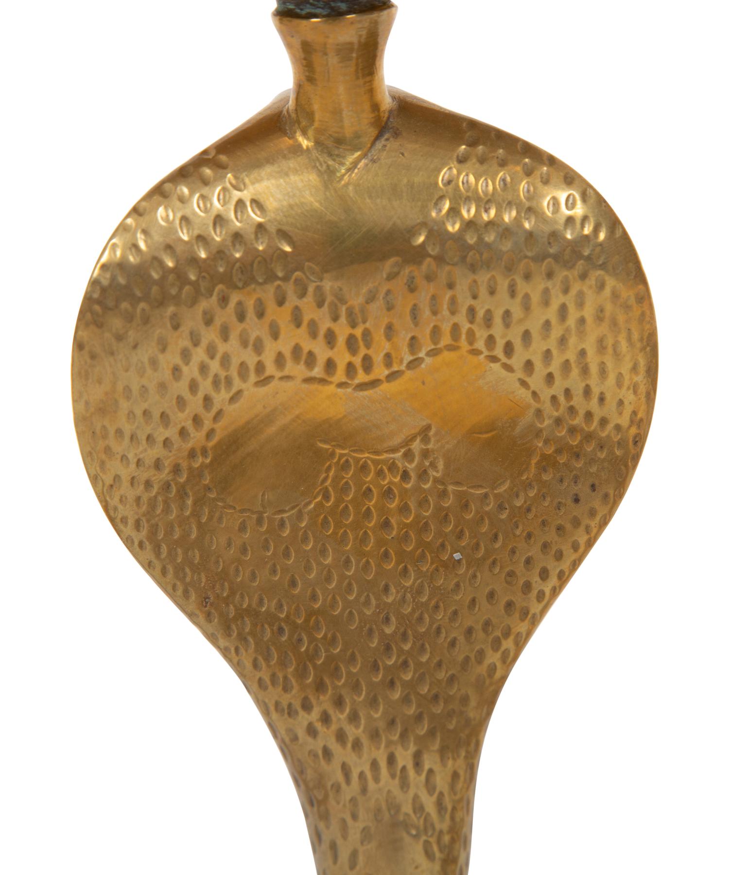 A Pair of Brass Cobra Candlesticks