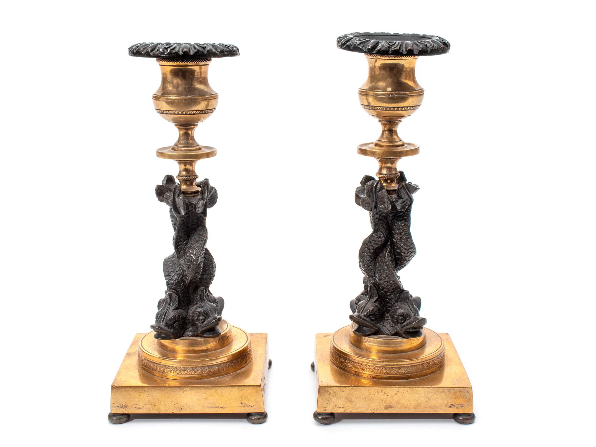 A Pair of French Gilt Bronze and Ebonized Figural Candlesticks — 19TH CENTURY