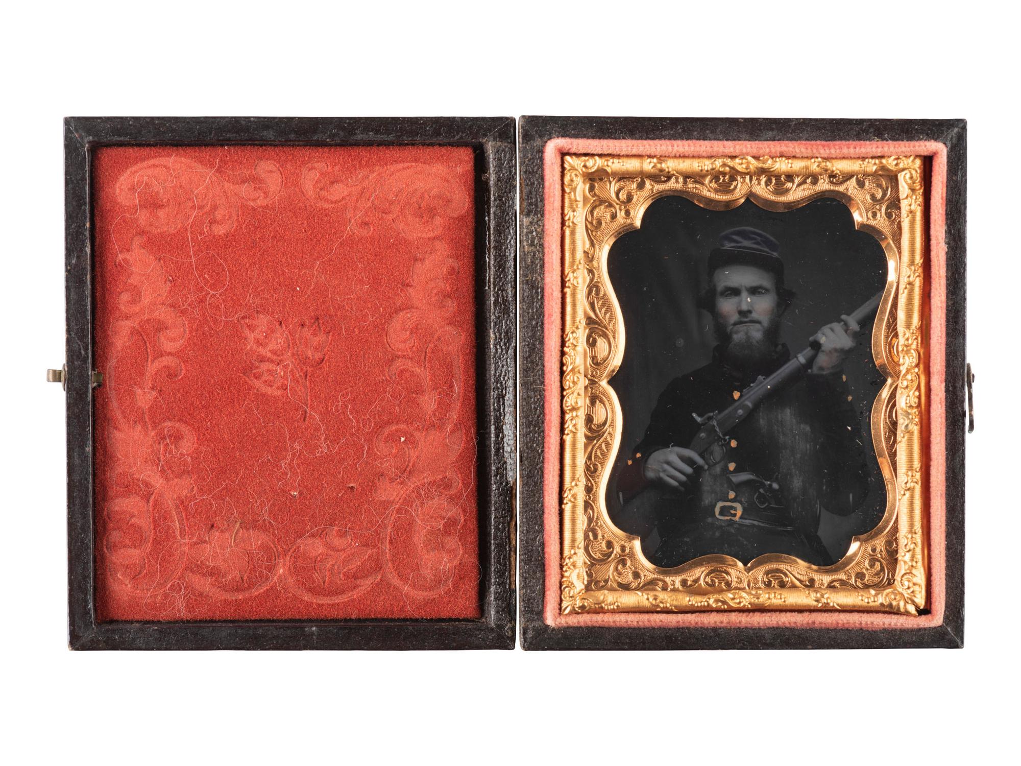 [CIVIL WAR]. Ninth plate ruby ambrotype of a doubled-armed Confederate officer from the "dead letter" file tentatively identified as Isaac A. Ing, 31st Tennessee Infantry. Richmond, Virginia: n.p., [1860s].