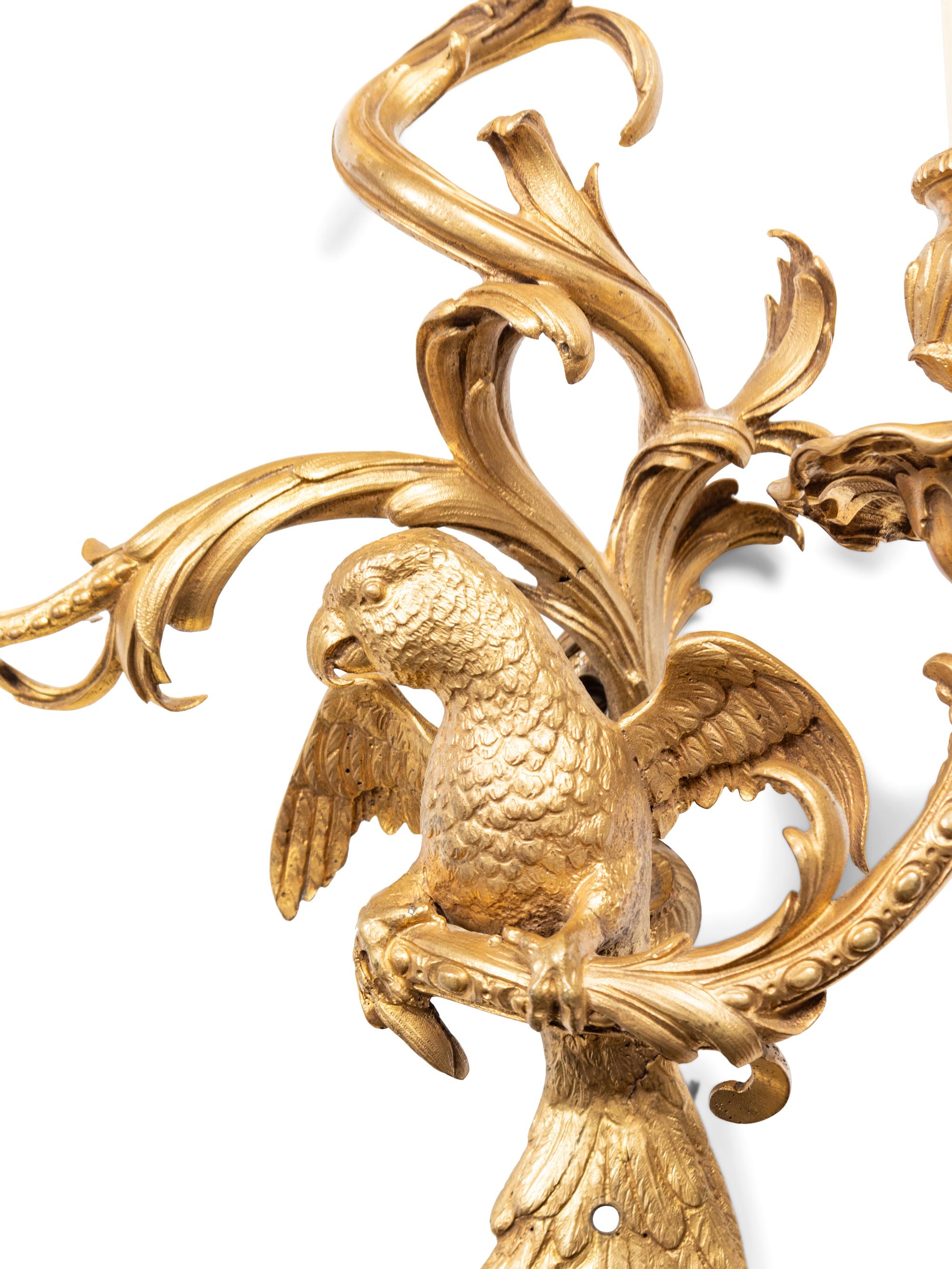A Pair of Louis XV Style Gilt Bronze Three-Light Sconces with Parrots