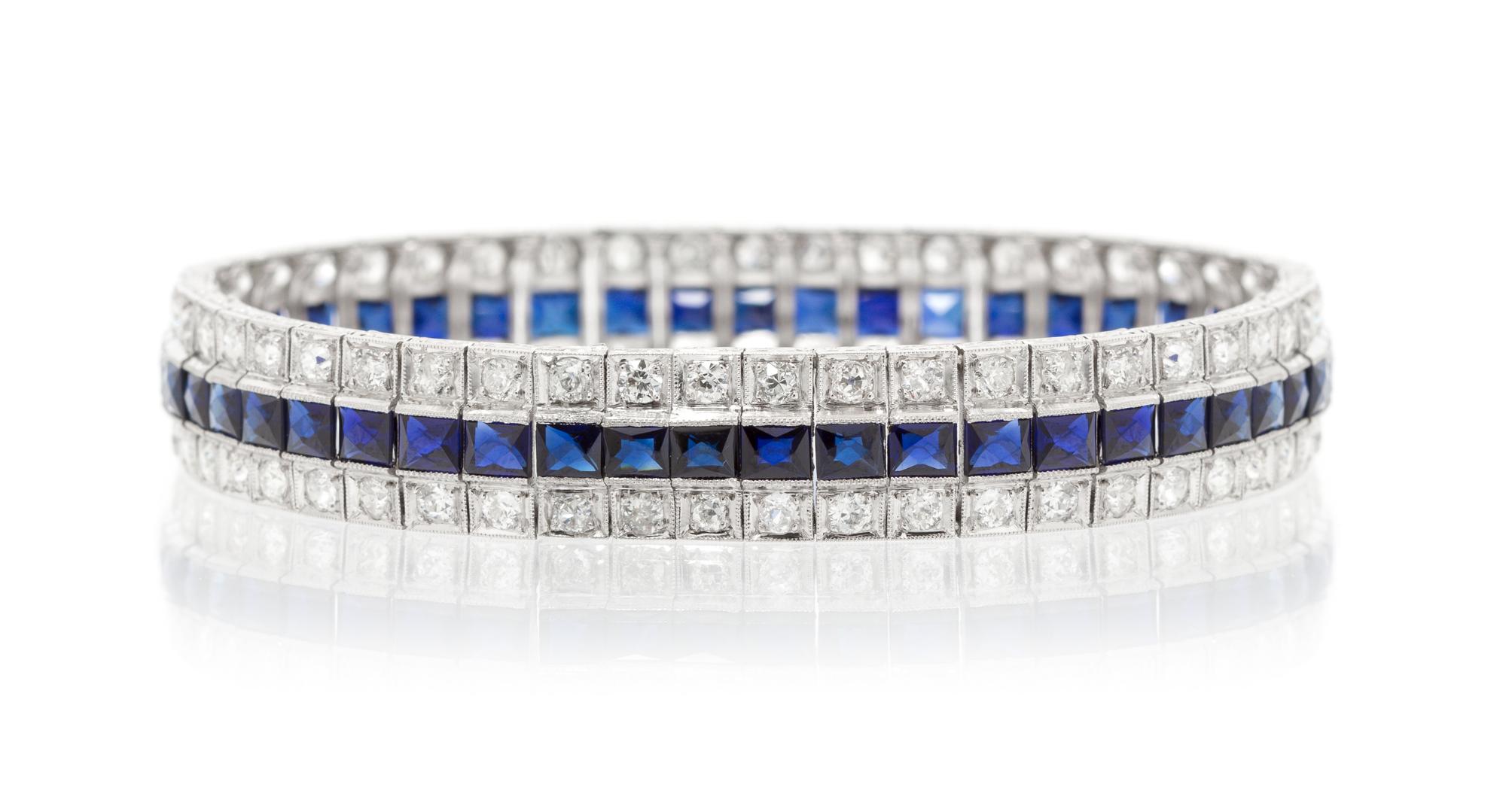 An Art Deco Platinum, Diamond and Synthetic Sapphire Bracelet, 23.10 dwts.