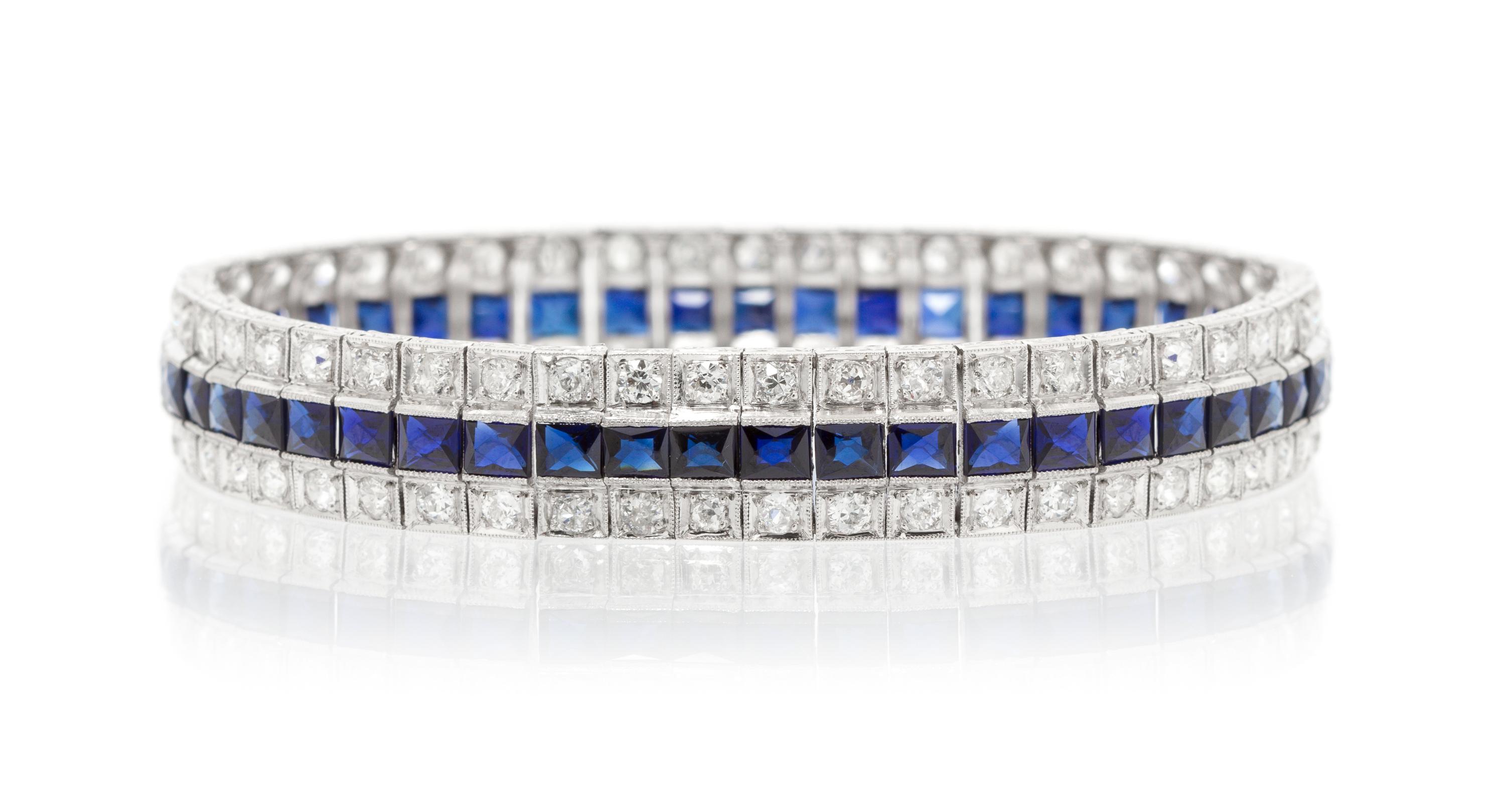 An Art Deco Platinum, Diamond and Synthetic Sapphire Bracelet, 23.10 dwts.